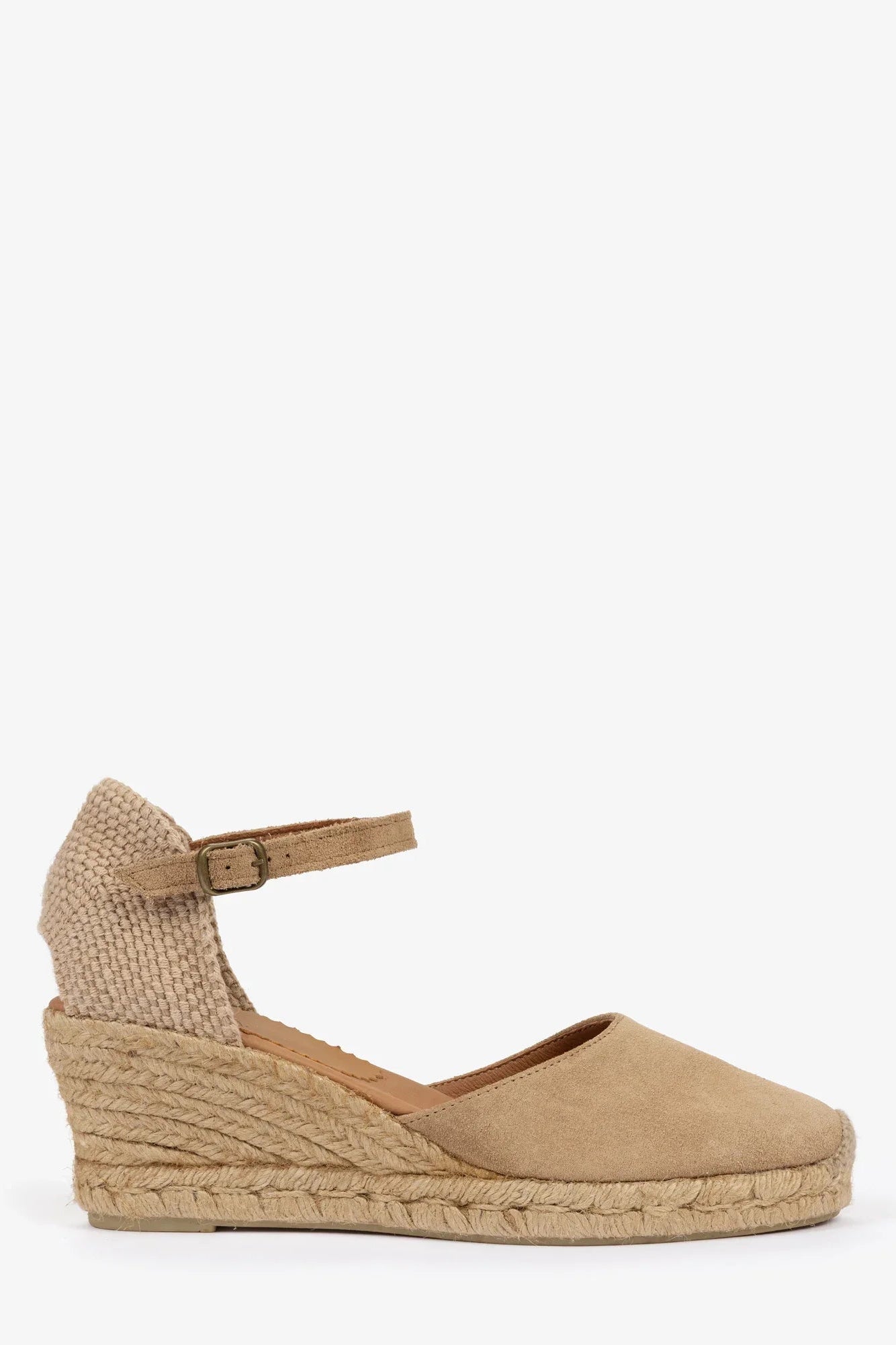 Beige wedge sandal with espadrille sole on a white background