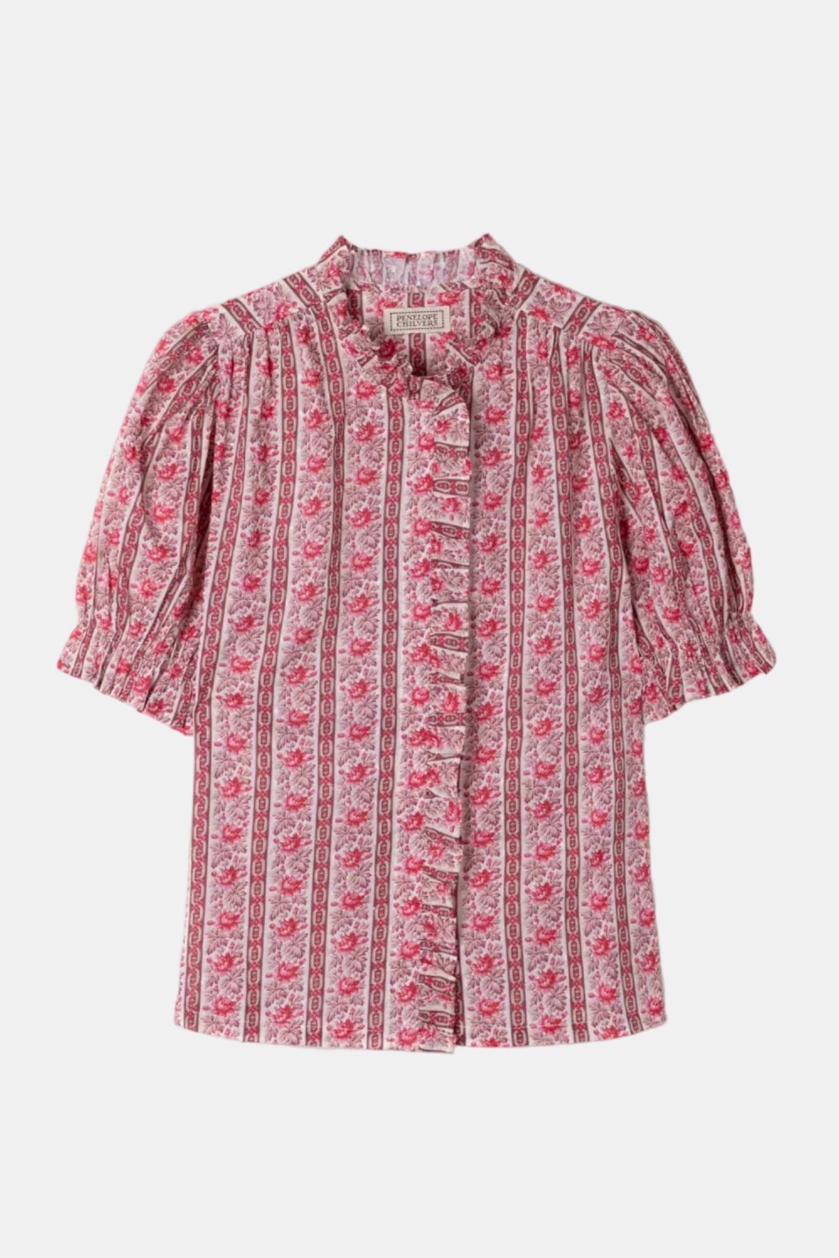 A women's short-sleeve blouse with puff sleeves, a ruffled collar, and a vertical ruffle down the front, featuring a pink and white floral print on a light background.