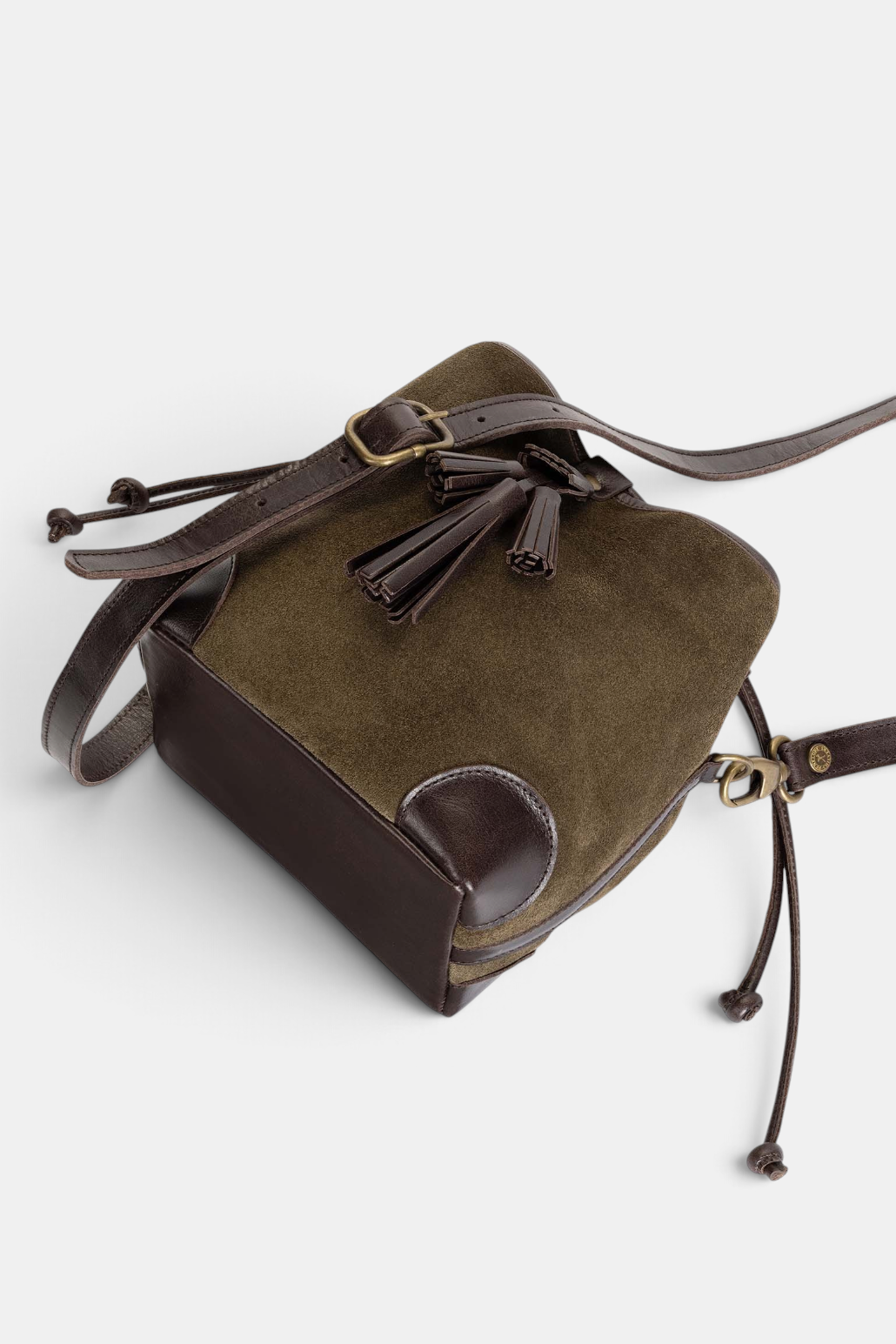 The Copper Shed khaki suede crossbody bag with bitter chocolate leather trim, adjustable strap and tiered tassel.