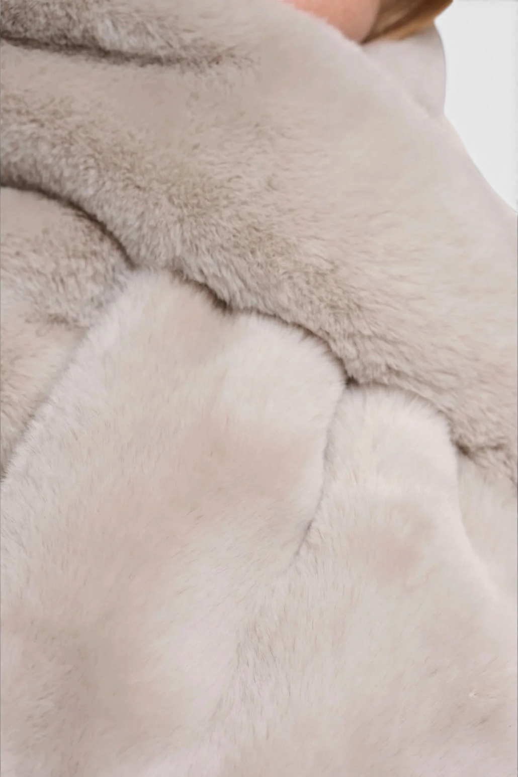 The Copper Shed beige faux fur scarf with a soft texture and looped design detail.