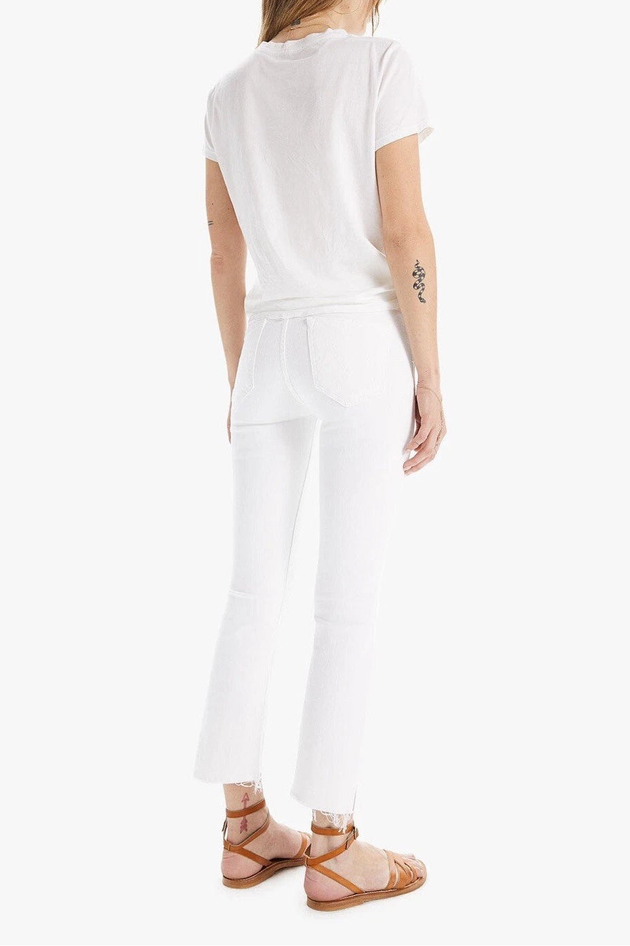 Woman wearing a white outfit on a white background