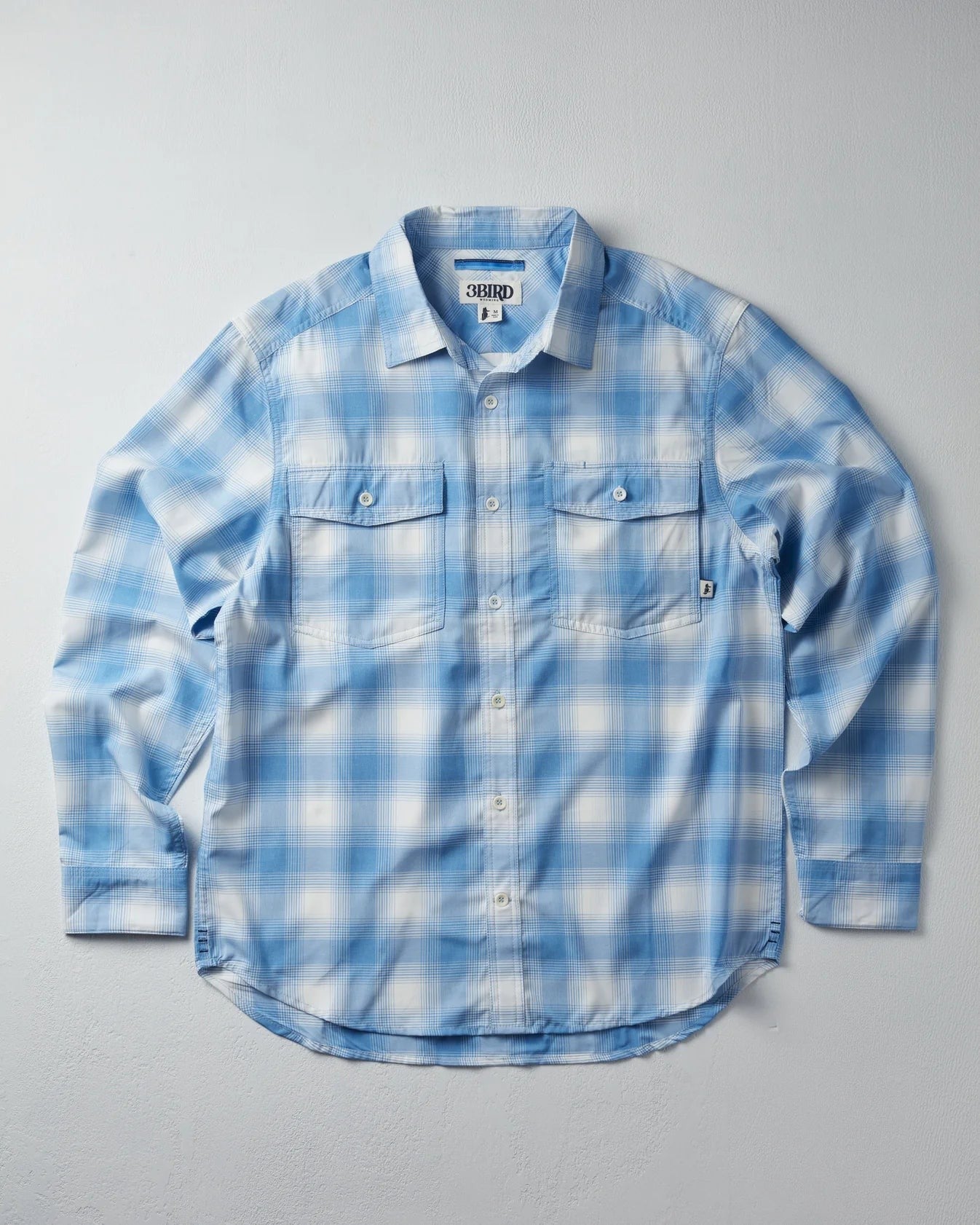 3bird Kingfisher LS Shirt in blue and white plaid. Lightweight, performance stretch woven shirt with UPF 50+ protection.