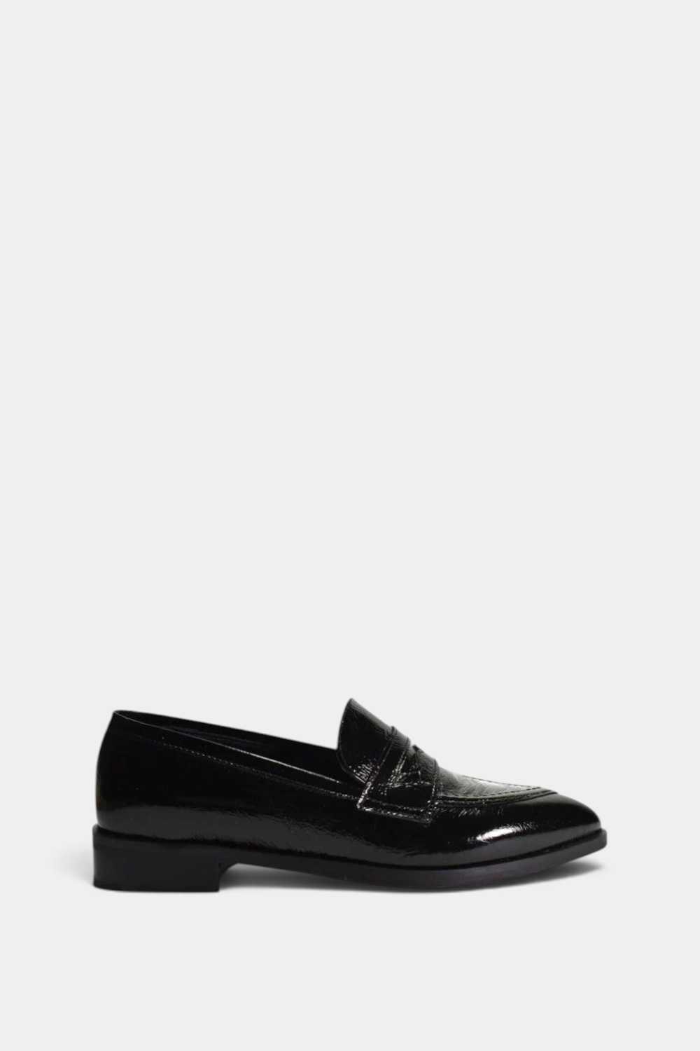 The Copper Shed Adrian black patent leather slip-on loafer with a pointy toe and low rubber heel.