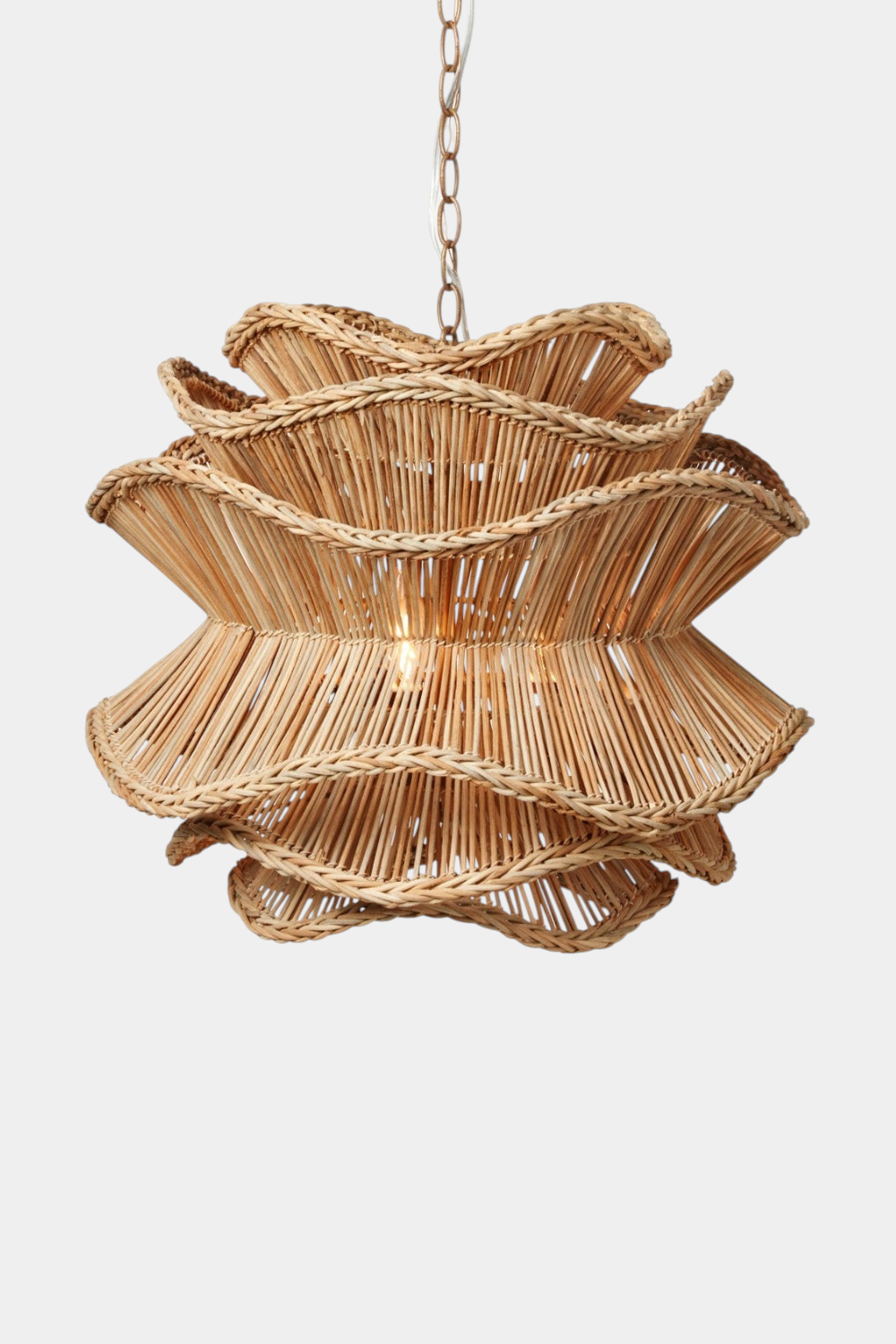 The Copper Shed Alondra Chandelier featuring six layers of natural braided rattan in a wavy floral-inspired design.