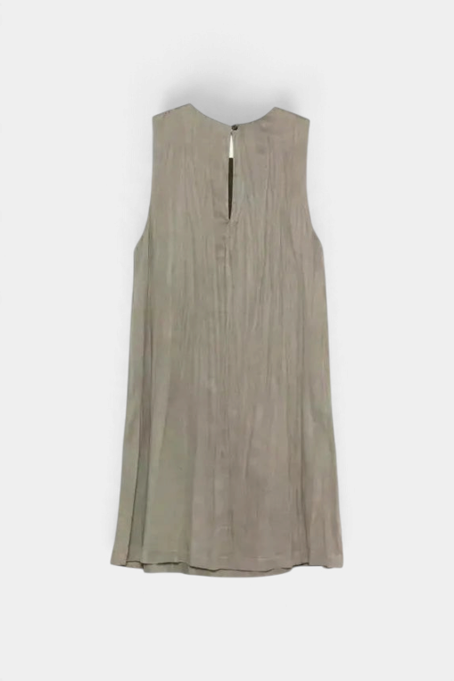 The Copper Shed Alysi sleeveless mini dress in grey with a crinkled texture, scoop neck, and back button fastening.