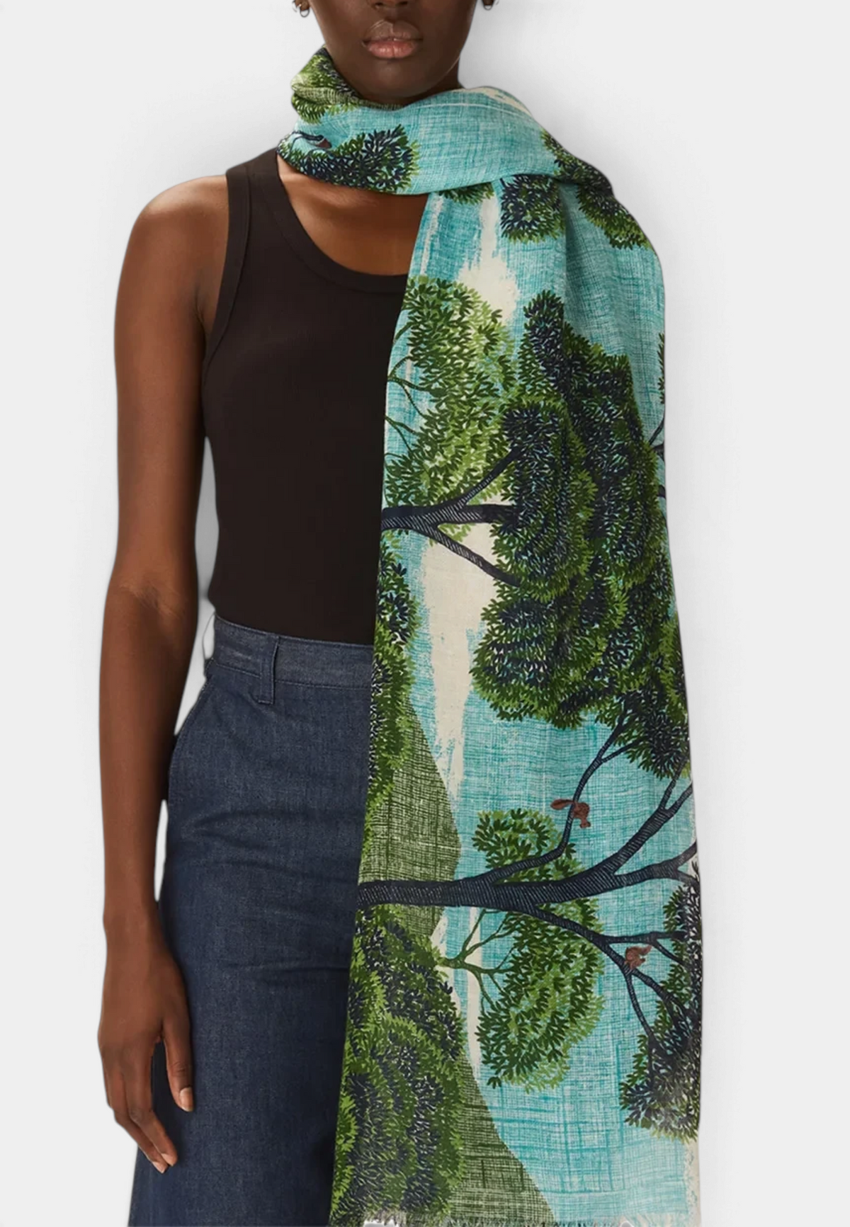 The Copper Shed Ambroise scarf in linen-cotton blend featuring a hand-printed green and teal forest landscape design.