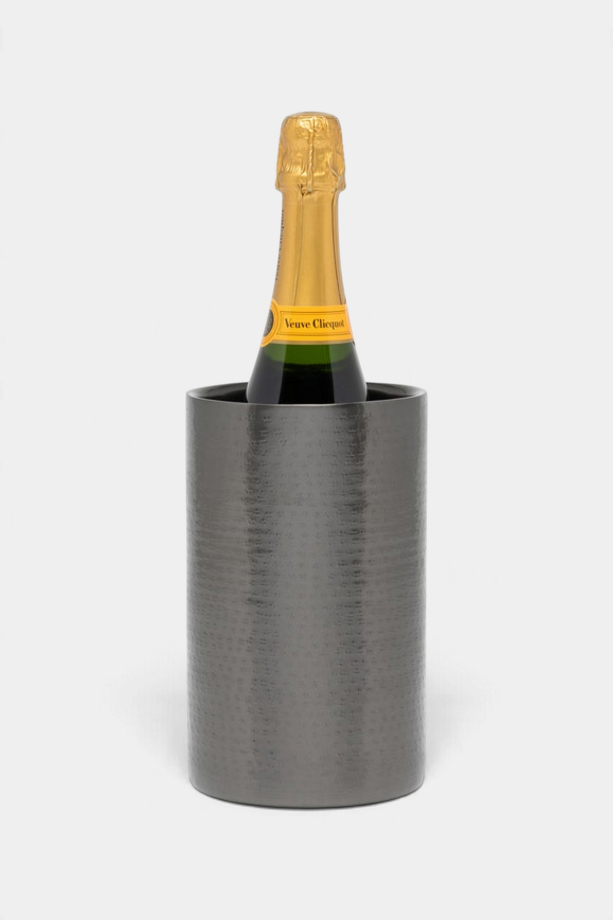 The Copper Shed Amherst wine chiller in dark nickel hammered stainless steel with a bottle of champagne inside