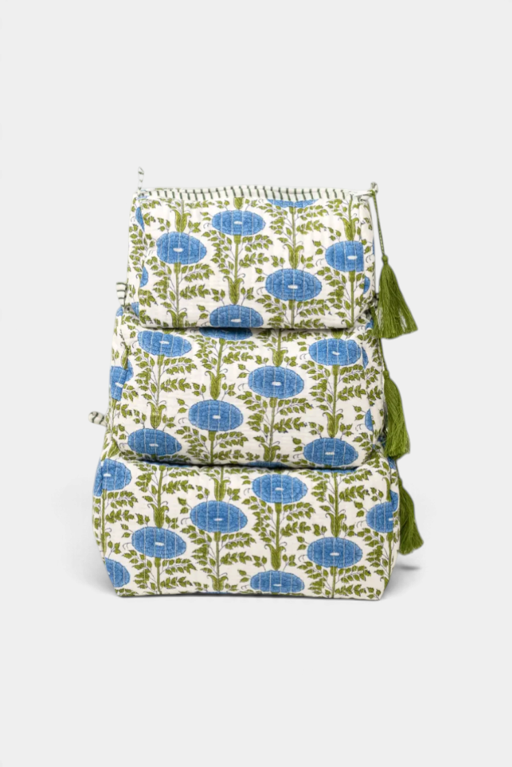 The Copper Shed Araminta medium toiletry bag featuring blue and green block-printed floral patterns with green tassels.