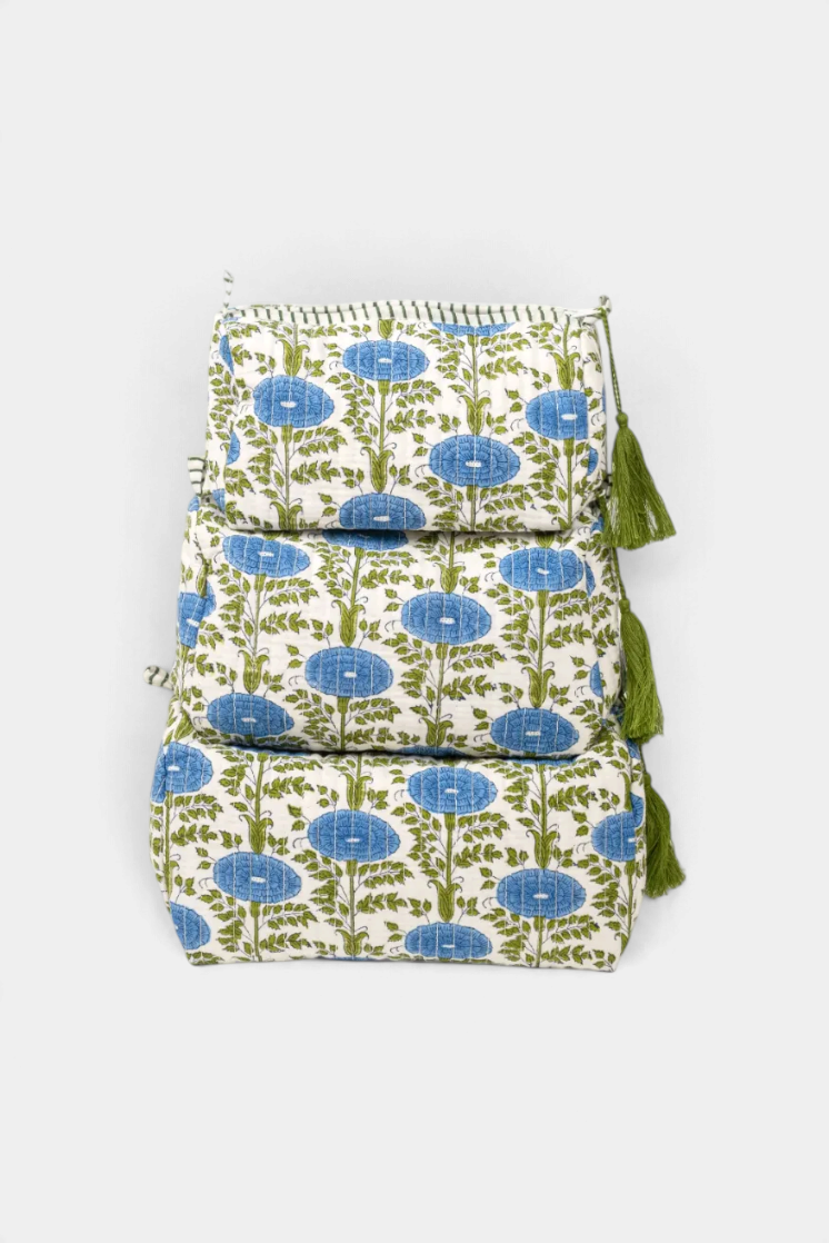 The Copper Shed Araminta medium toiletry bag featuring blue and green block-printed floral patterns with green tassels.