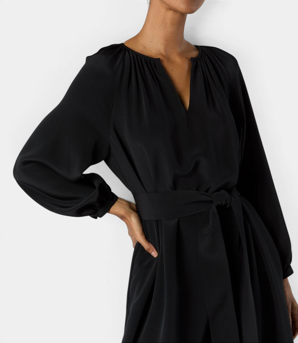 The Copper Shed black Ariana maxi dress in smooth crepe de chine with long sleeves and a tie waist belt.