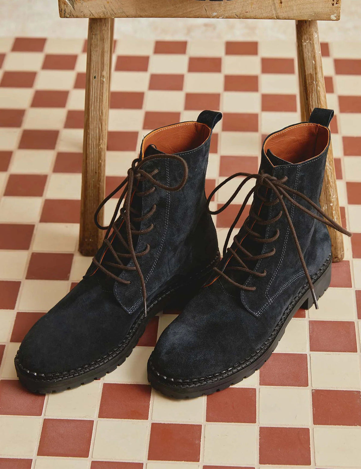 The Copper Shed Bartholomew navy suede lace-up boots with brown laces and a scalloped rubber tread sole.