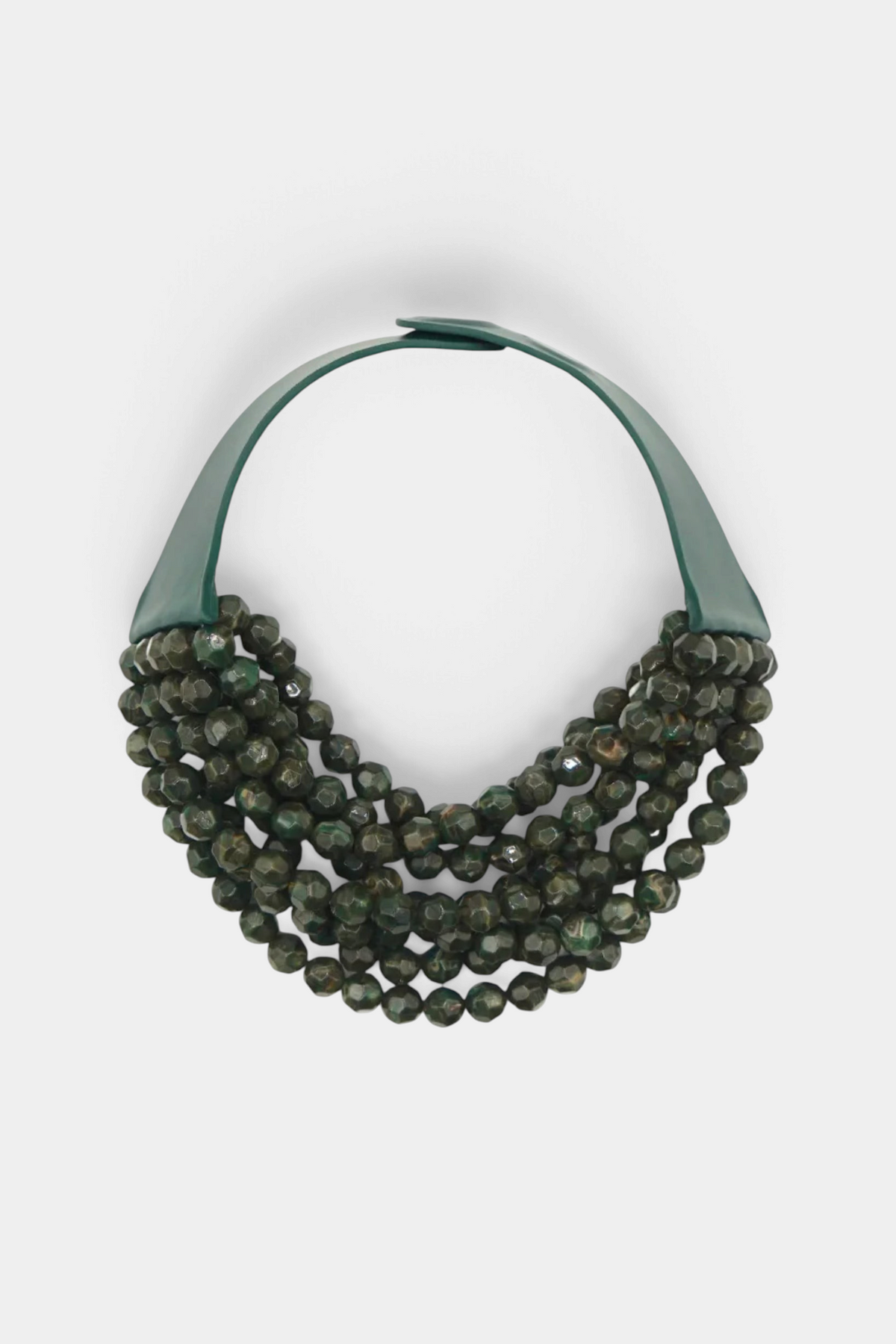 The Copper Shed Bella Marble Olive necklace featuring layered faceted dark green resin beads on a leather collar