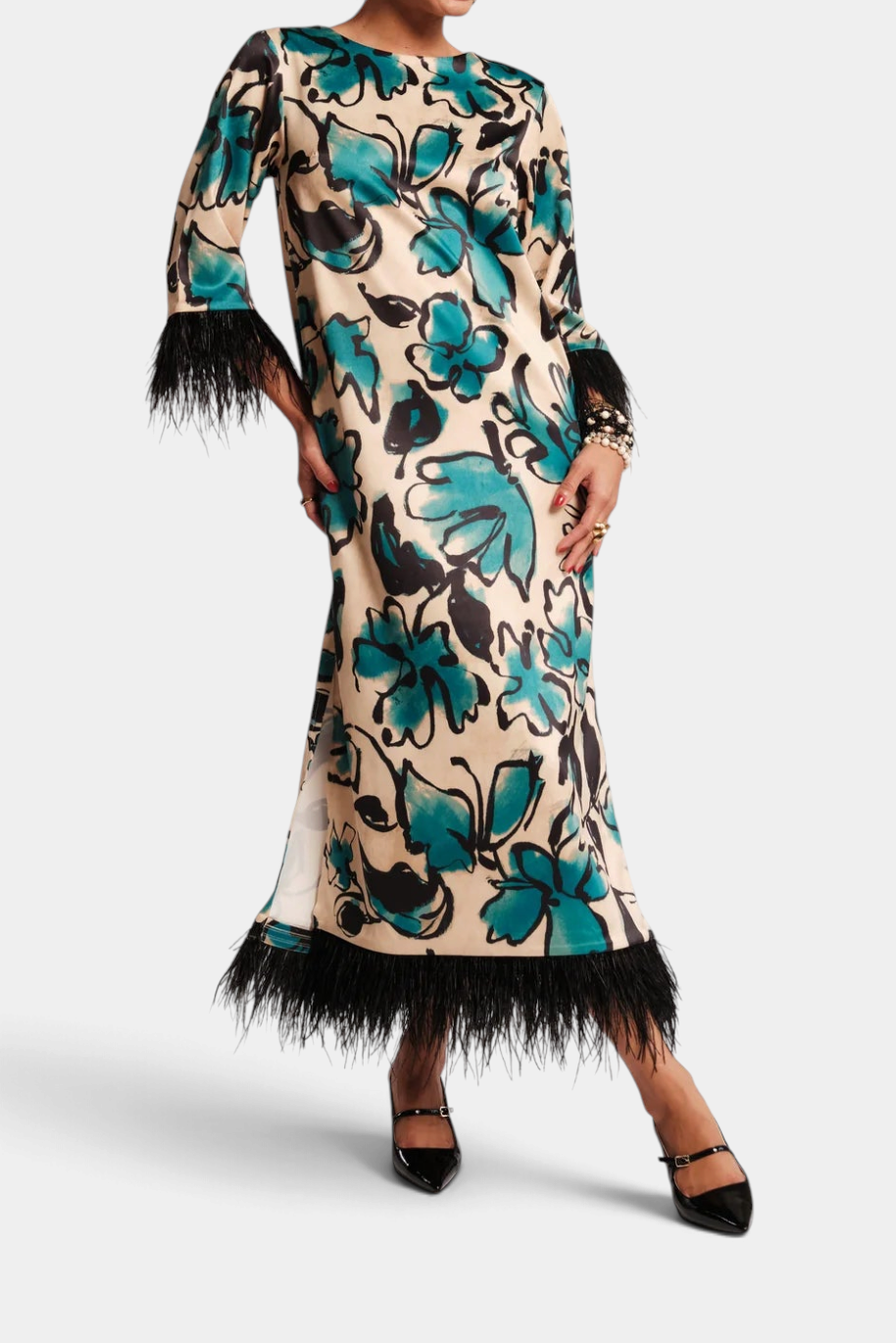 The Copper Shed Belle Maxi dress in Abstract Meadow print with long sleeves, side slits, and black faux-feather trim.