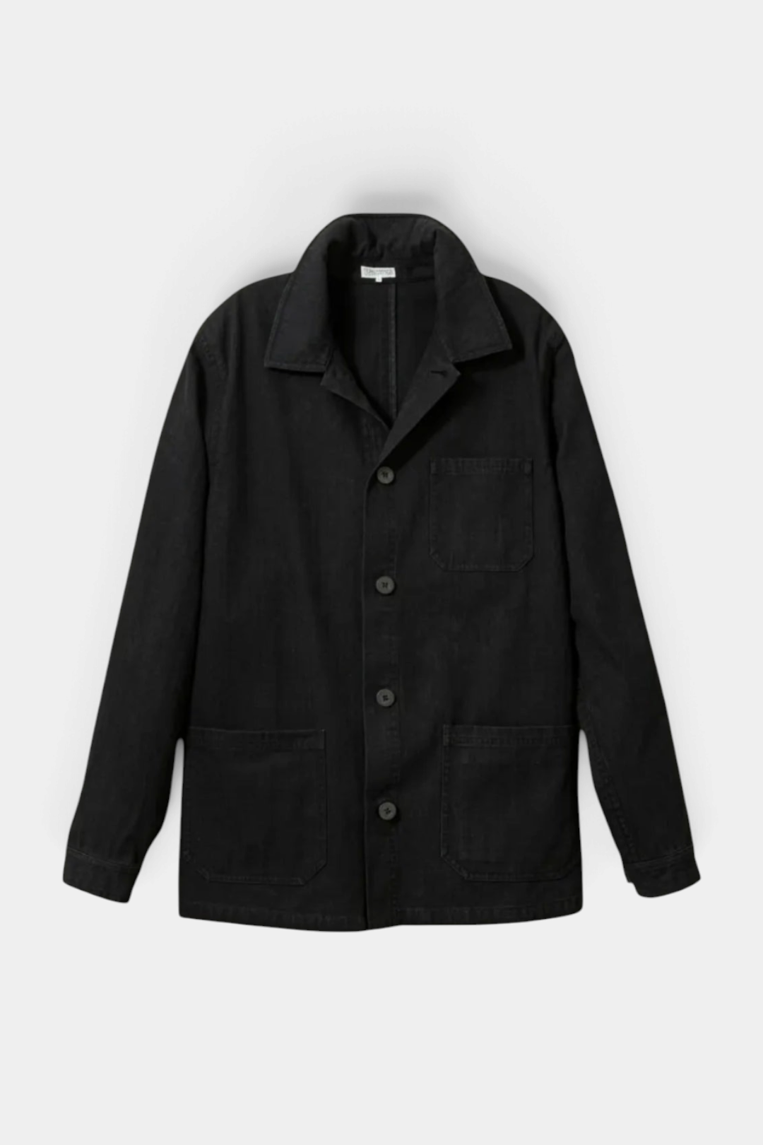 The Copper Shed black cotton French workman's jacket featuring three patch pockets and anchor-engraved buttons.