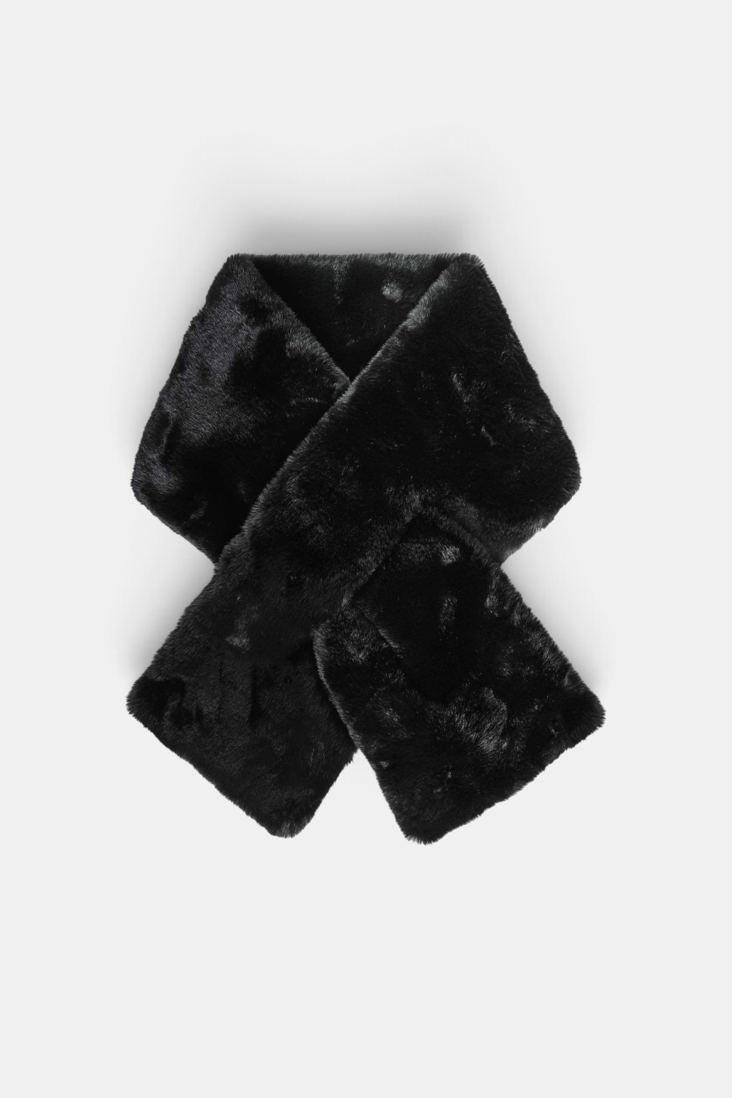 The Copper Shed black faux fur scarf with a pull-through design made from soft polyester.
