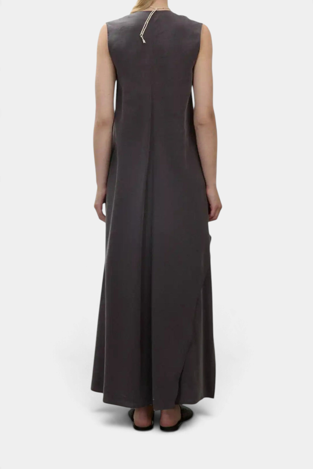 The Copper Shed black sleeveless long dress with a flared silhouette and V-neck, shown from the back view.