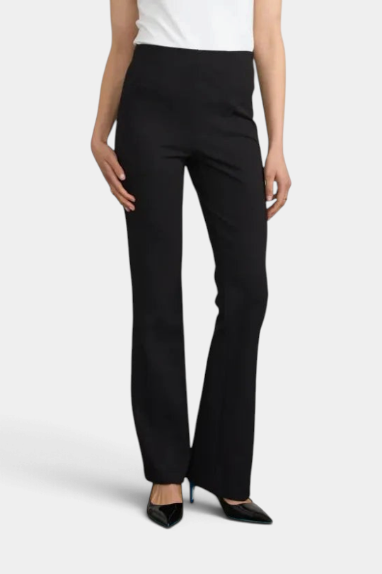 The Copper Shed black long flared pants in Japanese Ponte fabric with a fitted knee and side zipper closure.