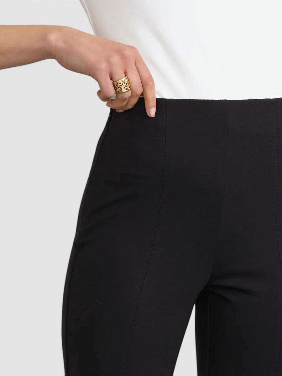The Copper Shed black Japanese Ponte flared pants featuring a side zipper and high-waisted fit on a model.