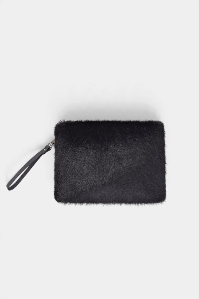 The Copper Shed black faux fur clutch bag with a detachable leather wrist strap and cotton drill lining.