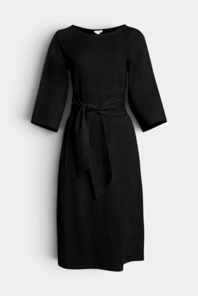 The Copper Shed Whitney midi wrap dress in black with a crew neckline, three-quarter sleeves, and adjustable waist tie.