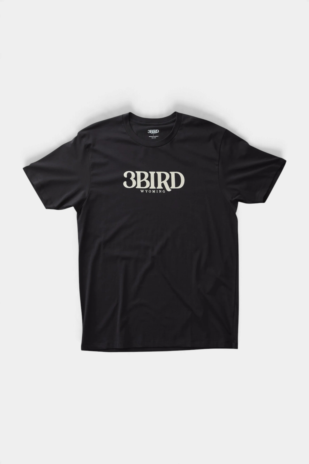 The Copper Shed 3B Tee in black organic cotton blend with white 3BIRD Wyoming graphic print on the chest