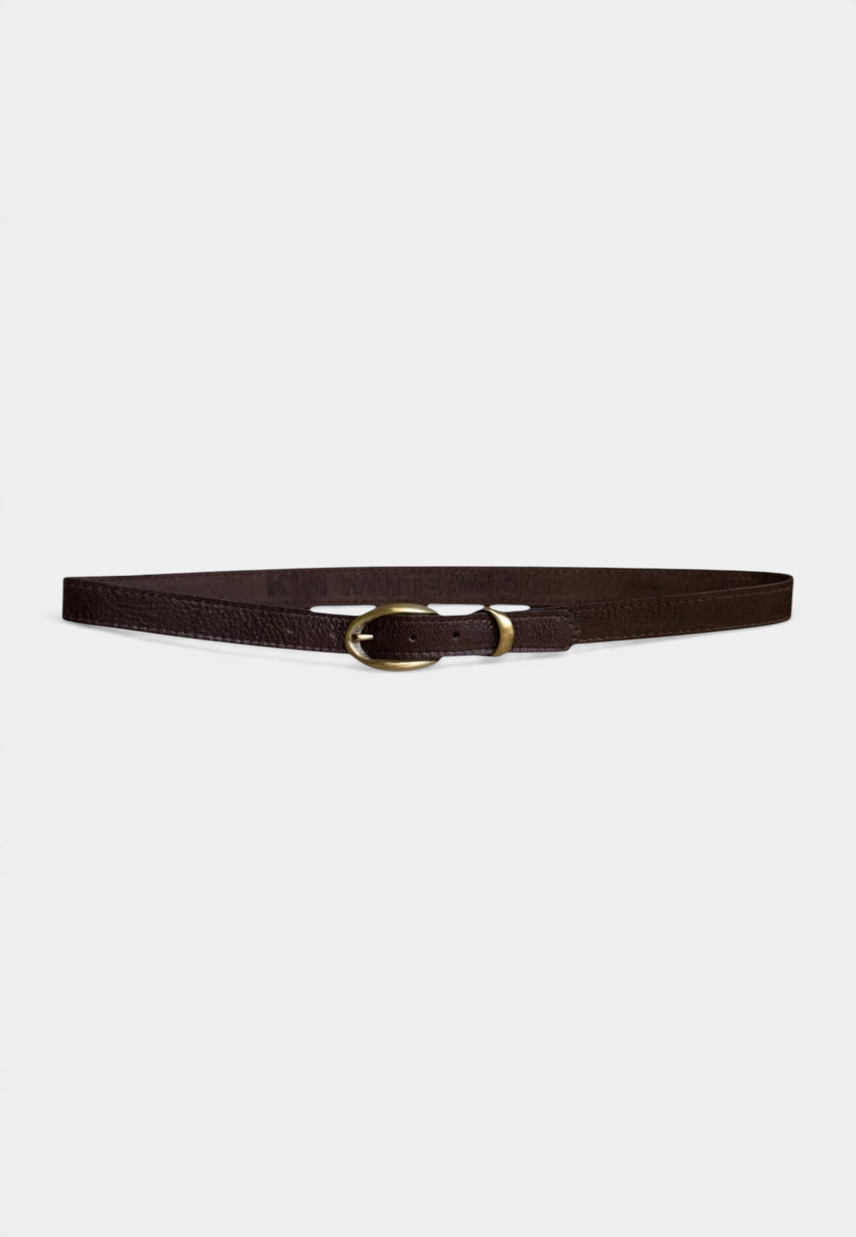 The Copper Shed black pebbled leather belt with an etched antique brass buckle and burgundy suede lining.