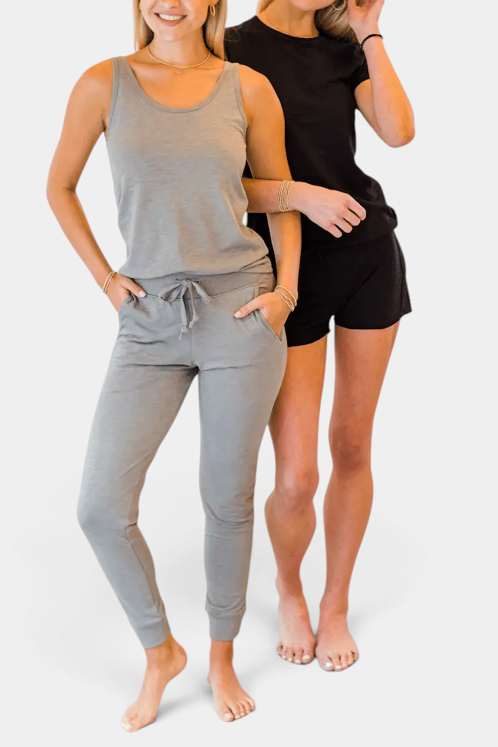 The Copper Shed black Pima cotton lounge shorts with raw edge trim worn by a model on a white background.