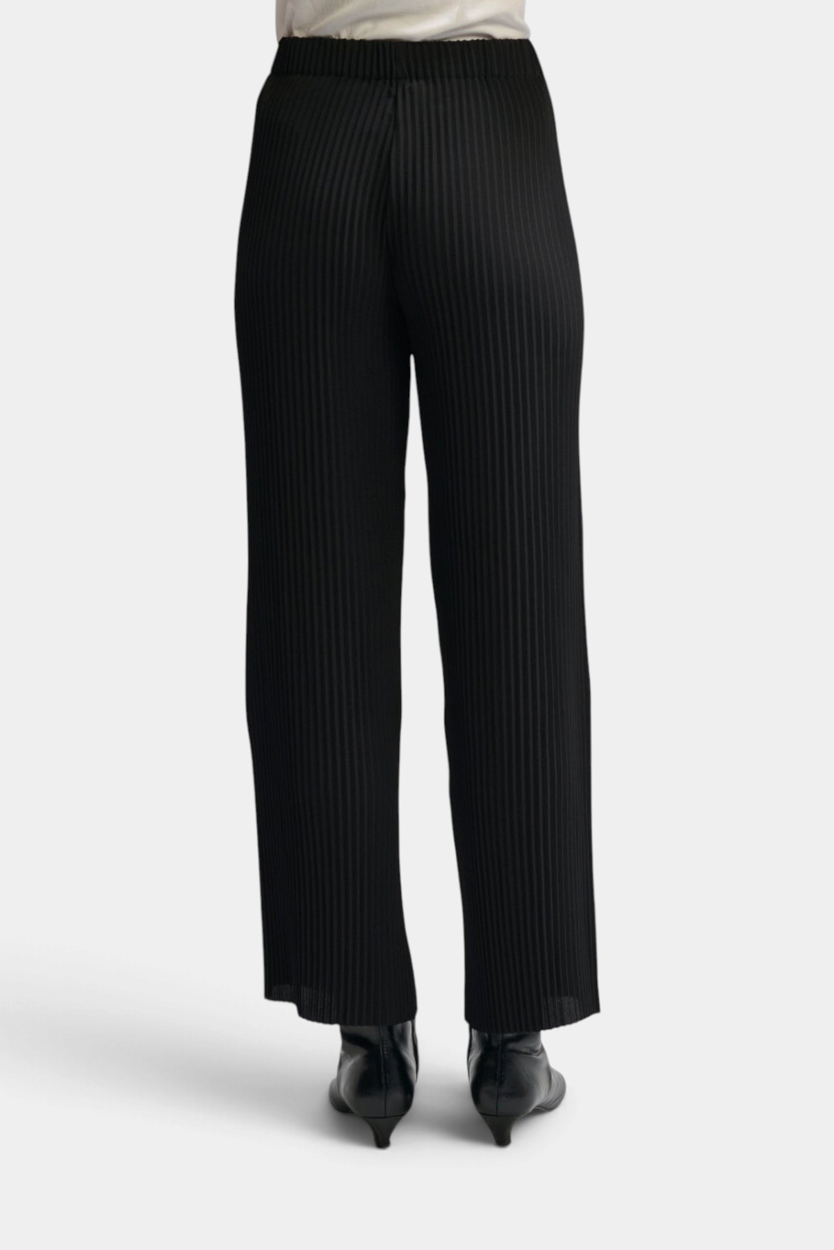 The Copper Shed black high-rise pleated pull-on pants with an elastic waistband, shown from the back.