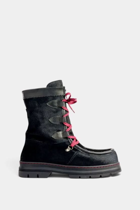 The Copper Shed Intrepid Pony Boot in black cowhide with red laces, shearling lining, and a sturdy rubber sole.