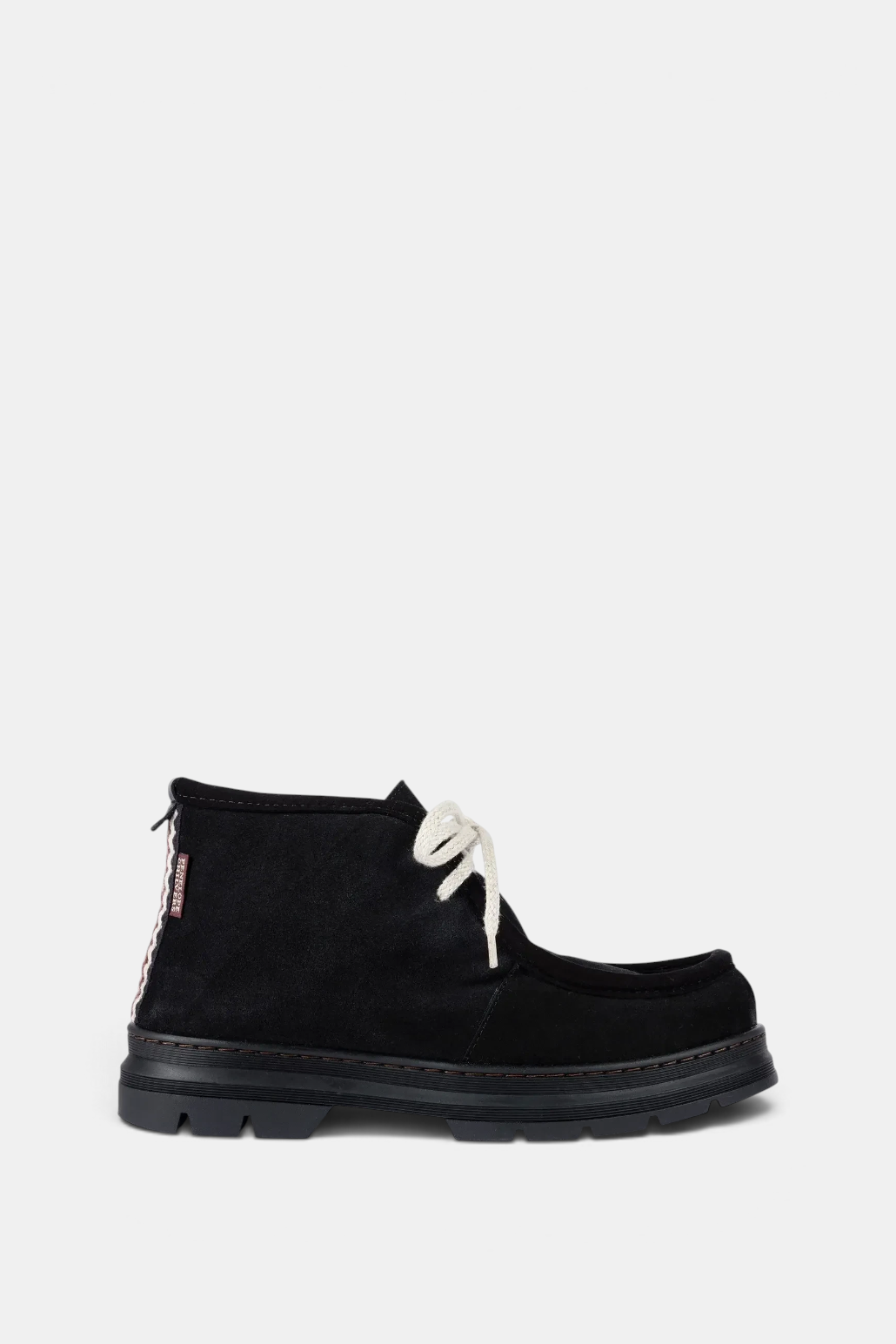The Copper Shed Phenomenal black split suede boot with shearling lining, ecru laces, and folk trim heel detail.