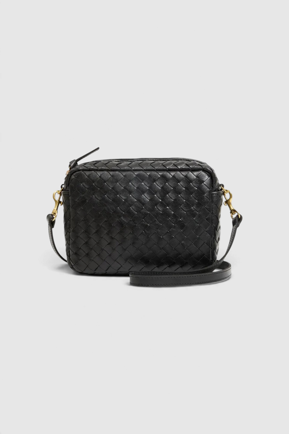 The Copper Shed black handwoven leather crossbody midi sac with a rectangular shape and adjustable strap.