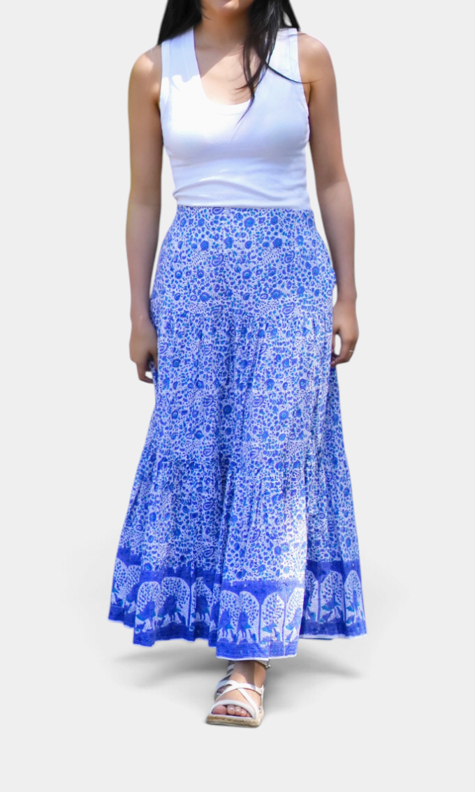 The Copper Shed ankle length tiered cotton skirt in blue with intricate floral block print patterns.
