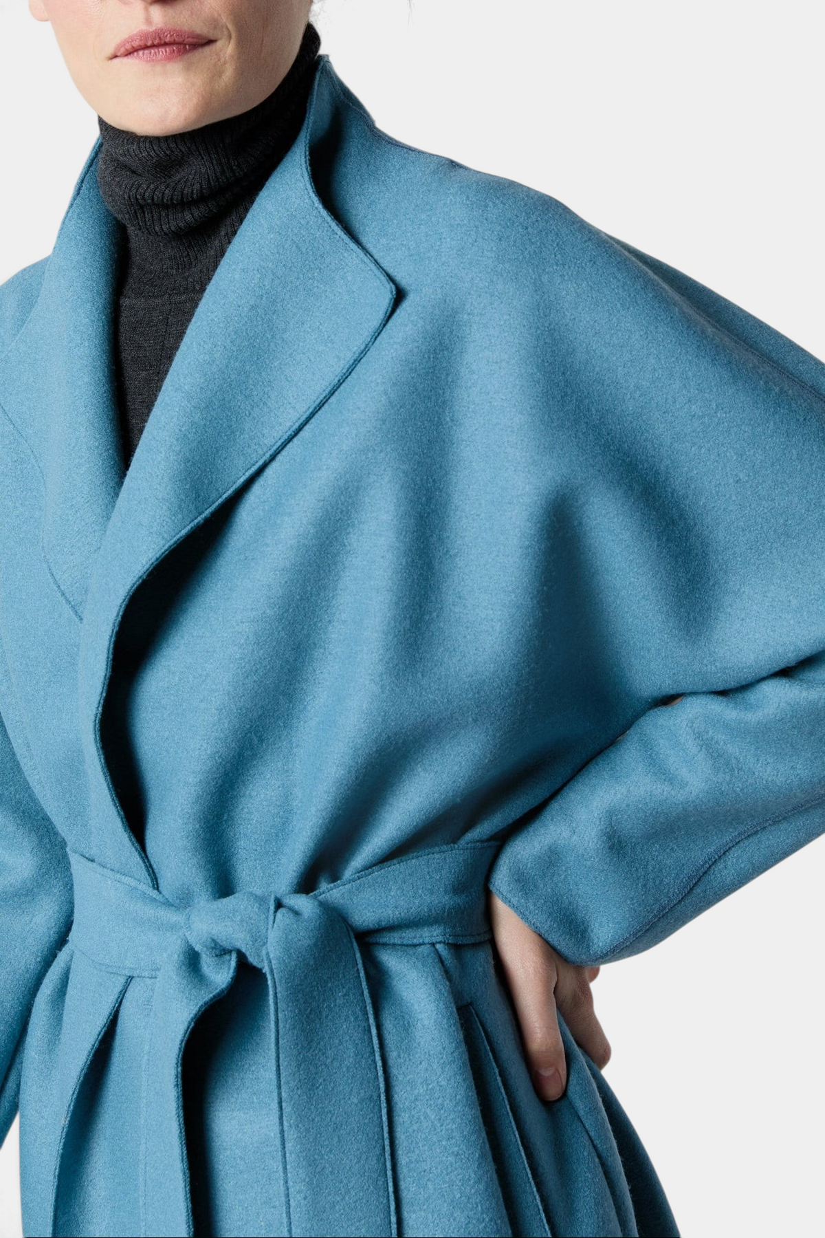 The Copper Shed Kimono Carina wrap coat in blue Italian boiled wool with a belted waist and wide sleeves