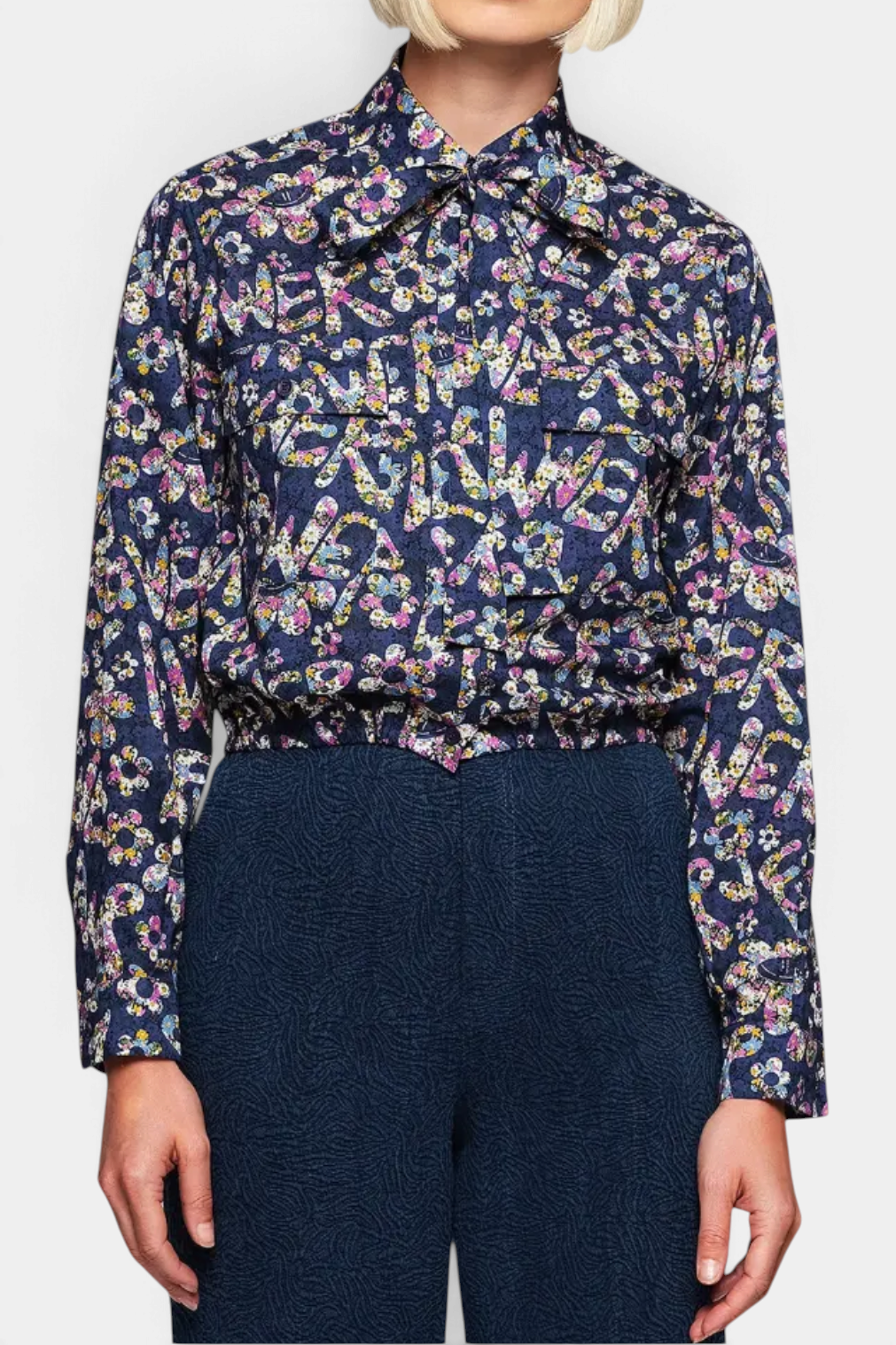 The Copper Shed blue cotton shirt with Liberty floral print, removable tie-up collar, and elasticated hem.