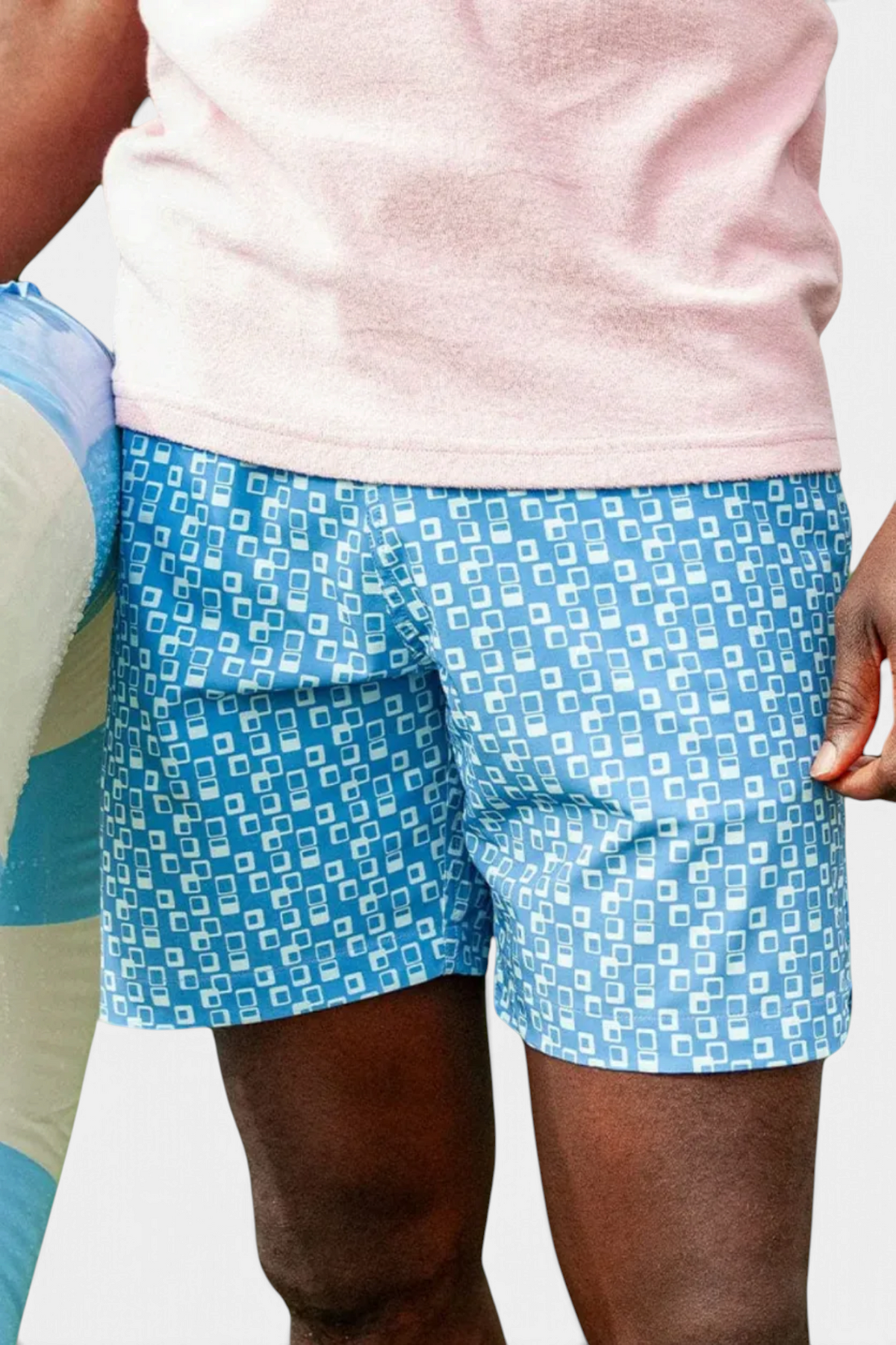 The Copper Shed blue swim trunks with a white geometric square pattern, featuring an elastic drawstring waistband.