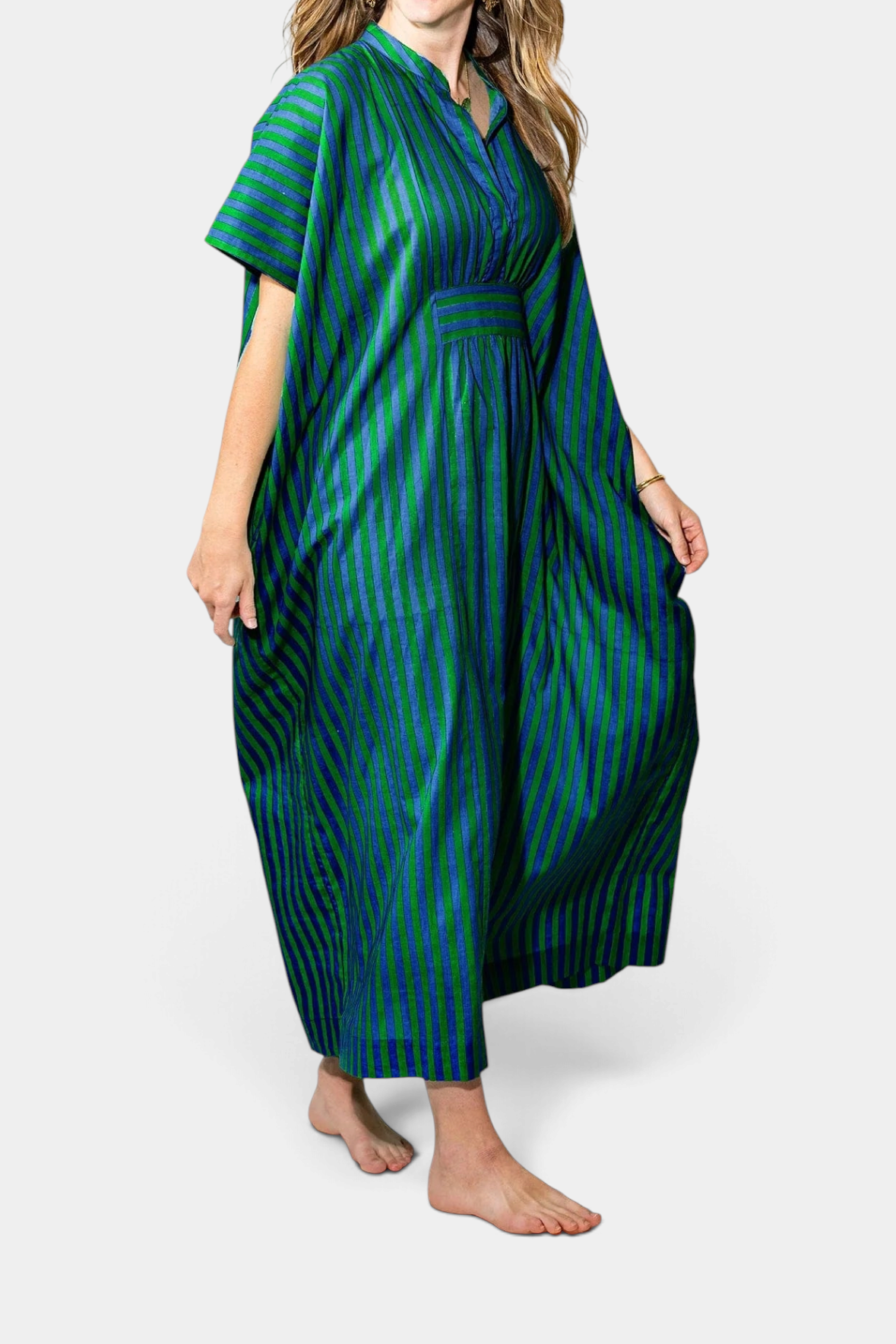 The Copper Shed Margot stripe kaftan in green and blue vertical stripes with an oversized flowy silhouette.