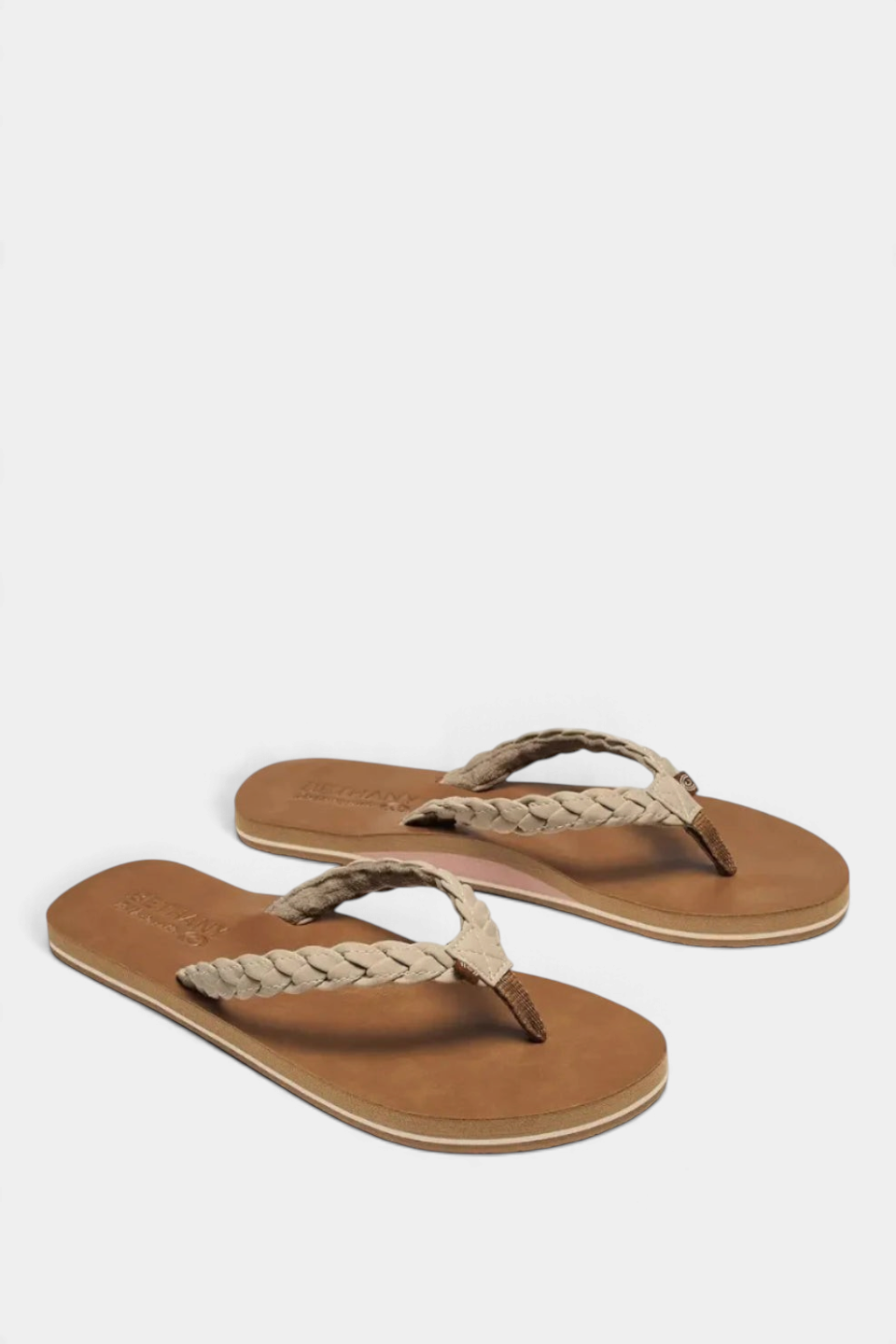 The Copper Shed Braided Pacifica flip flops featuring tan synthetic leather soles and comfortable braided straps.