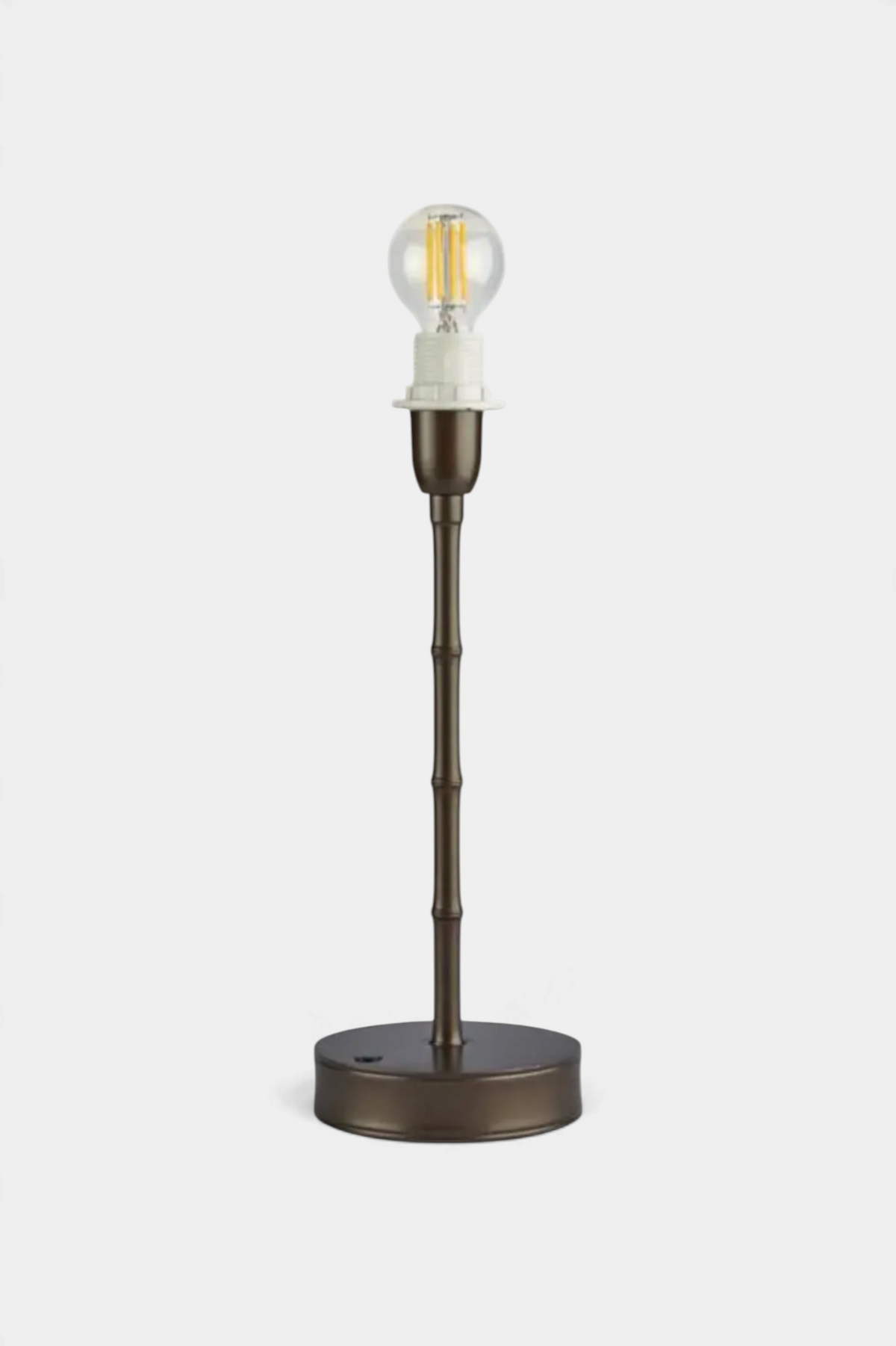 The Copper Shed rechargeable bamboo-style lamp base in a bronze finish with an exposed filament LED bulb.