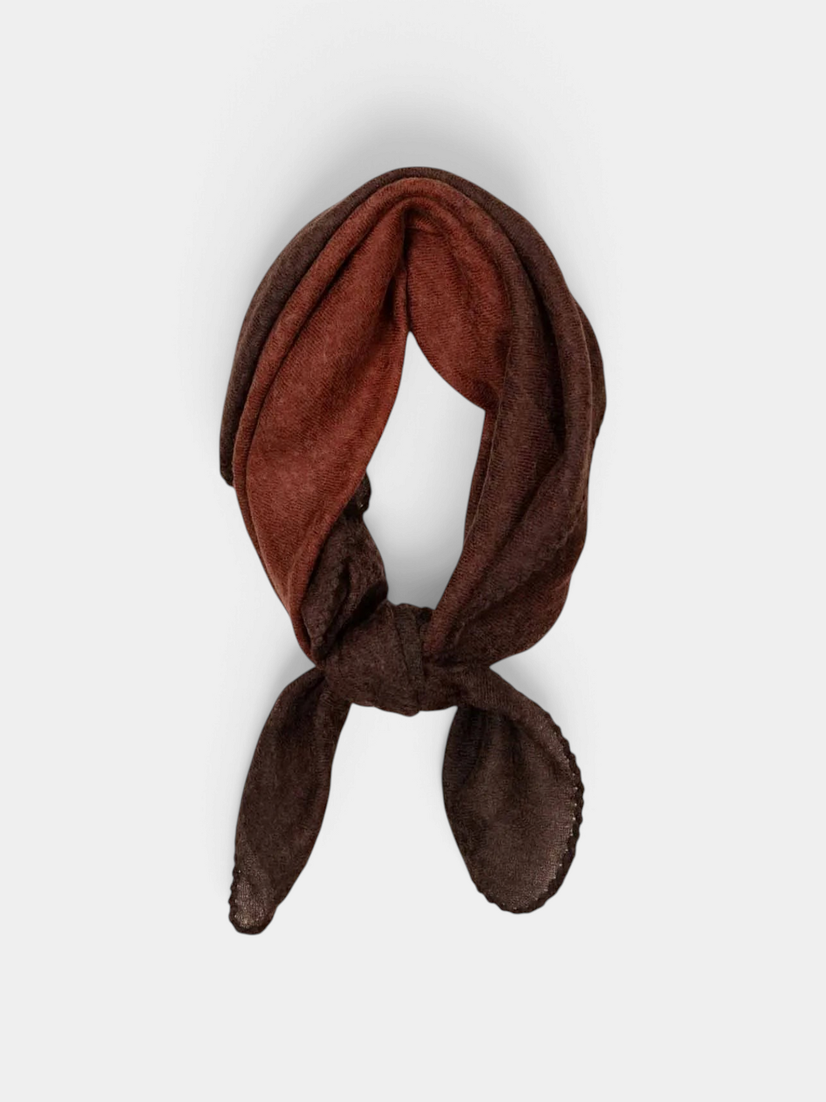 The Copper Shed Muse cashmere foulard in dark brown, featuring a hand-stitched edge and tied in a simple knot.