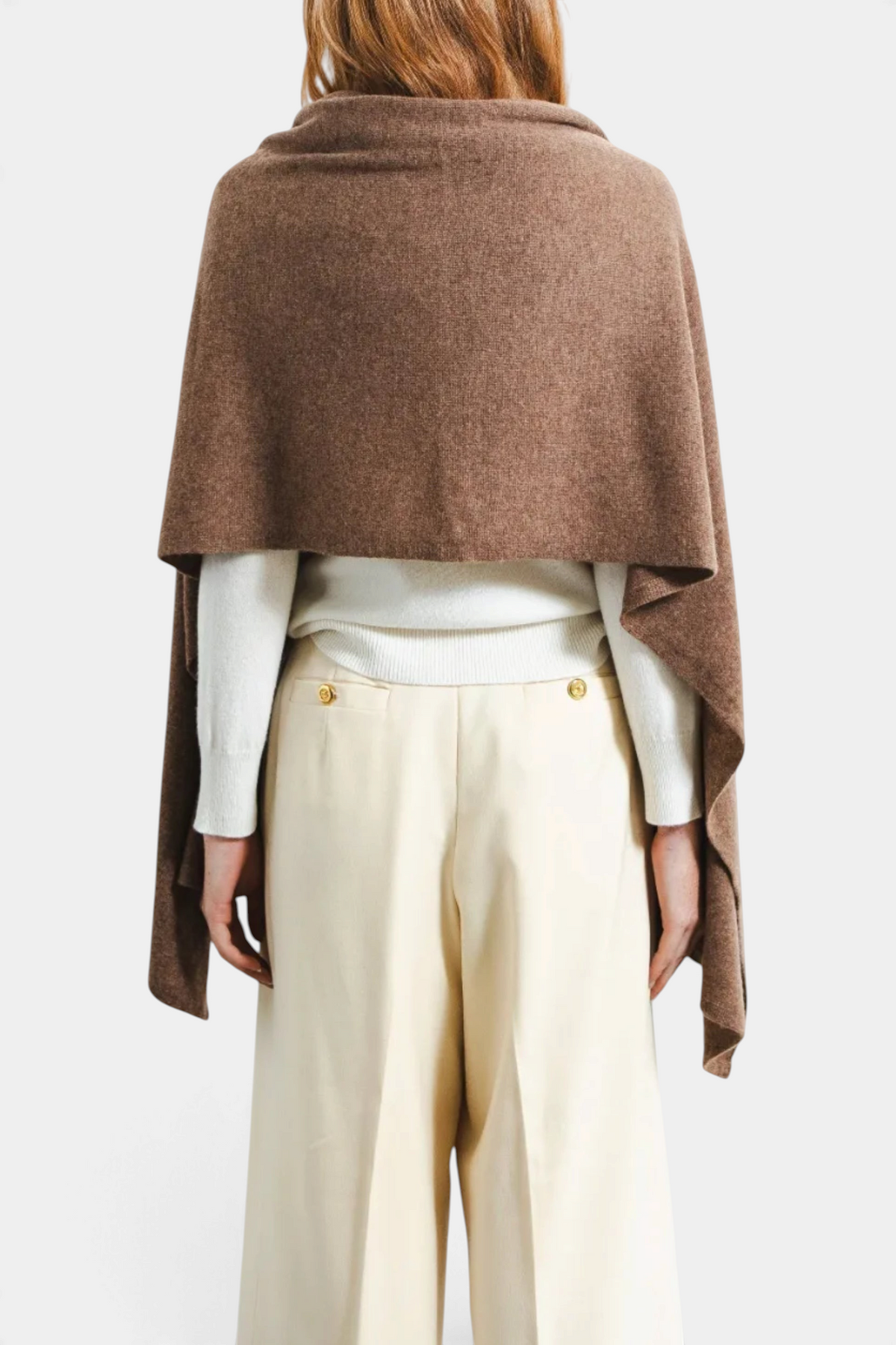 The Copper Shed oversized brown cashmere travel wrap draped over a model's shoulders, back view