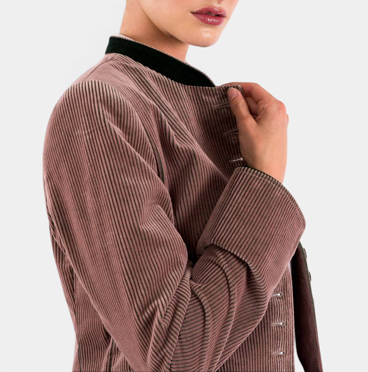 The Copper Shed women's brown corduroy blazer with a high collar and button-up front, side profile view.