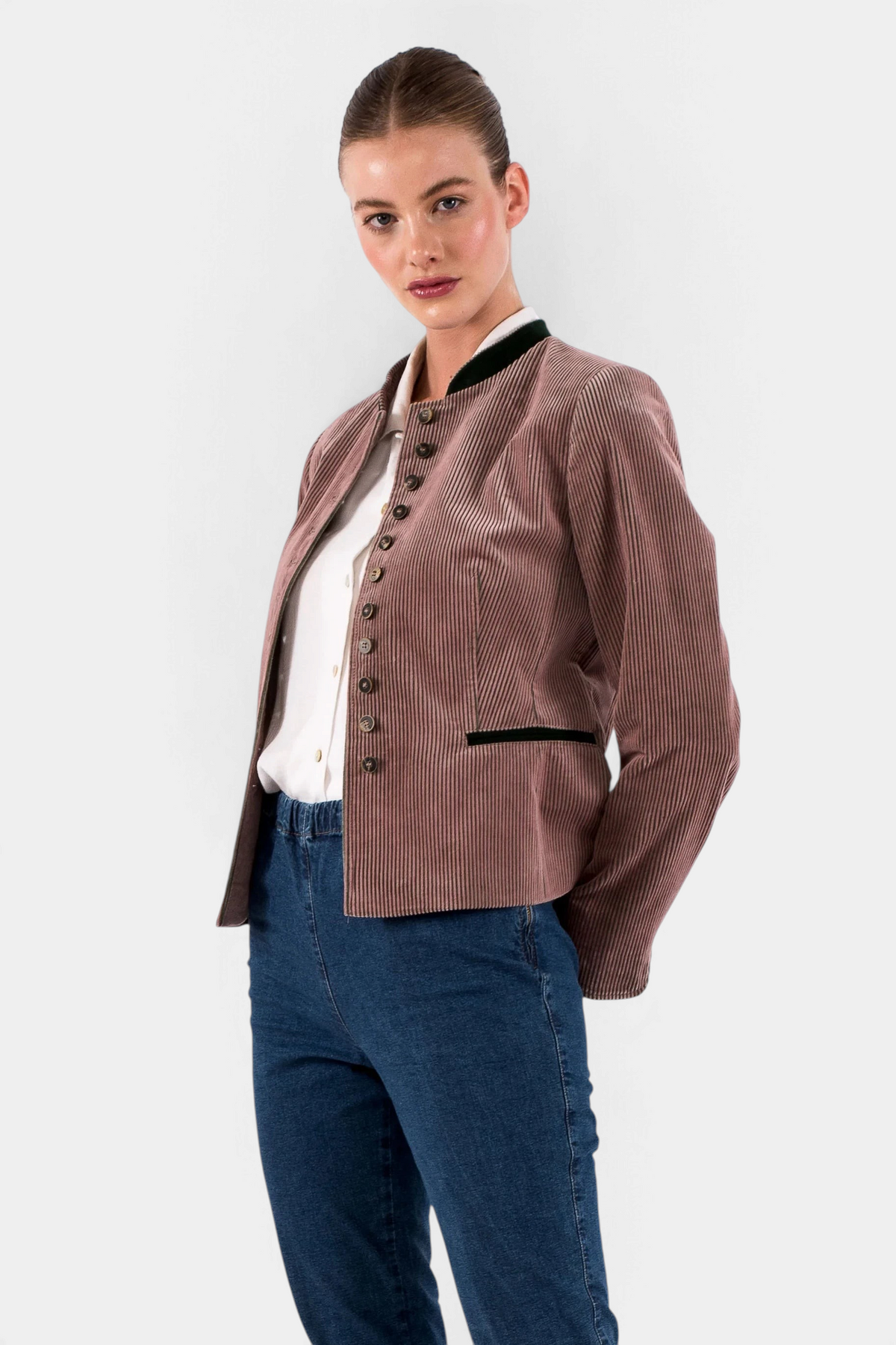 The Copper Shed women's brown corduroy Alpine blazer with dark green trim and button-up front on a model