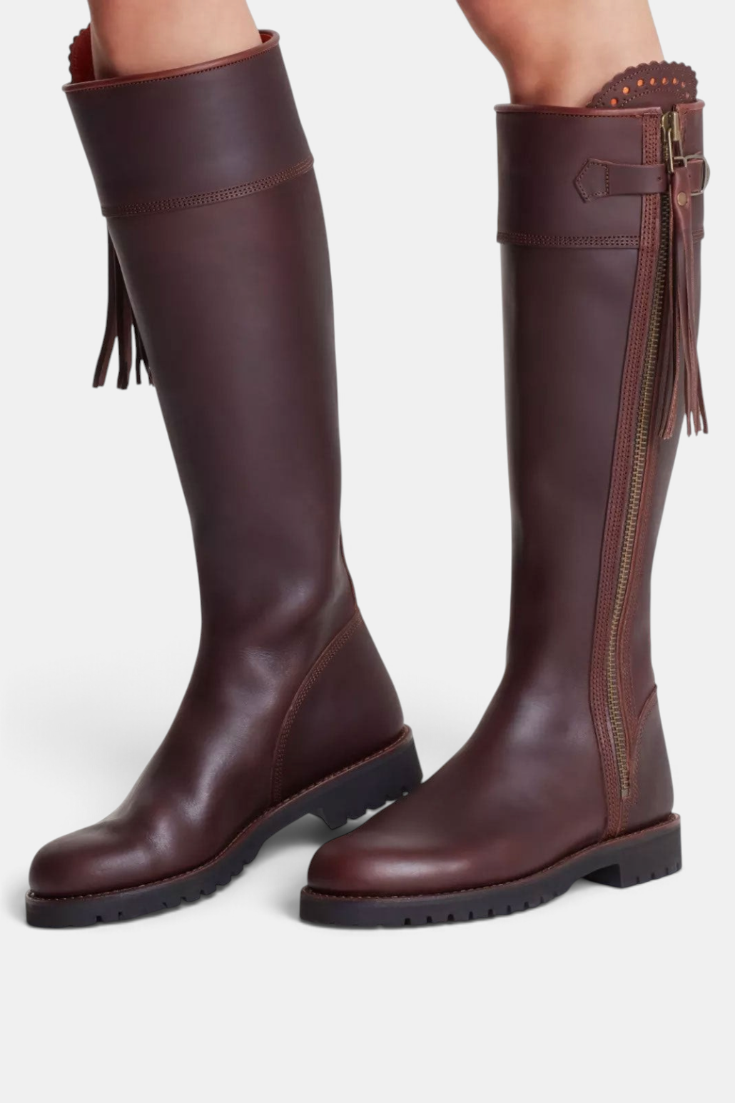 The Copper Shed brown leather knee-high boots with side zip, tassel detail, and durable Goodyear welt rubber sole.