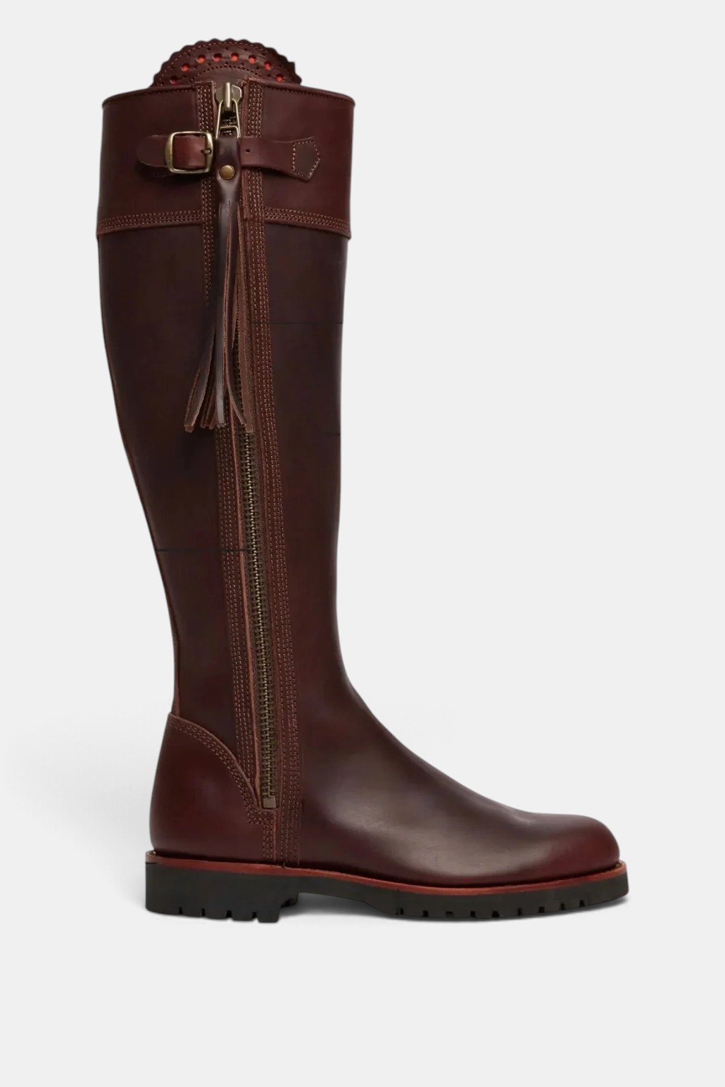 The Copper Shed brown leather knee-high tassel boots with side zip, buckle strap, and Goodyear welted rubber sole.