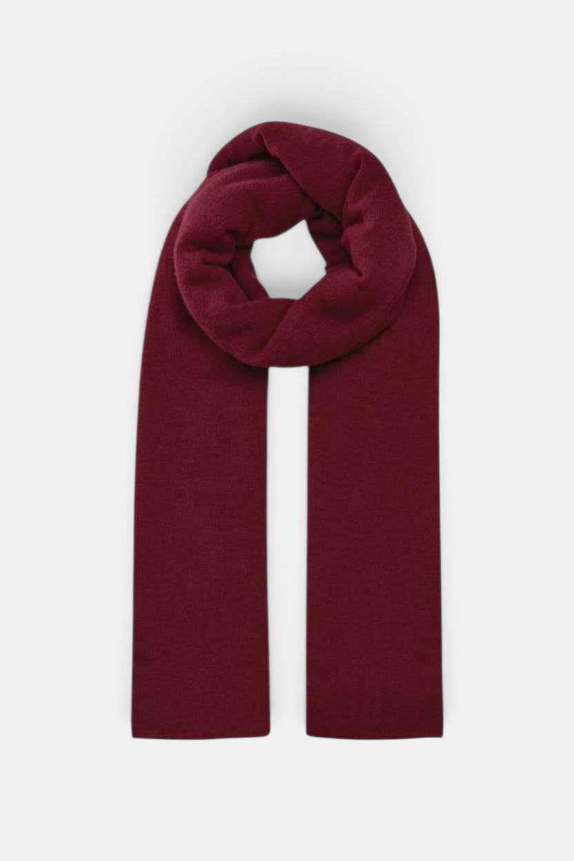 The Copper Shed featherweight wrap in a deep burgundy red, featuring a soft, lightweight knit texture.