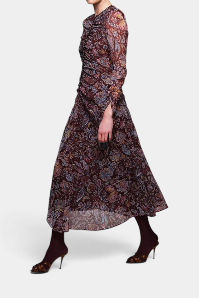 The Copper Shed burgundy crinkle chiffon midi dress with paisley print, draped bodice, and long sleeves.