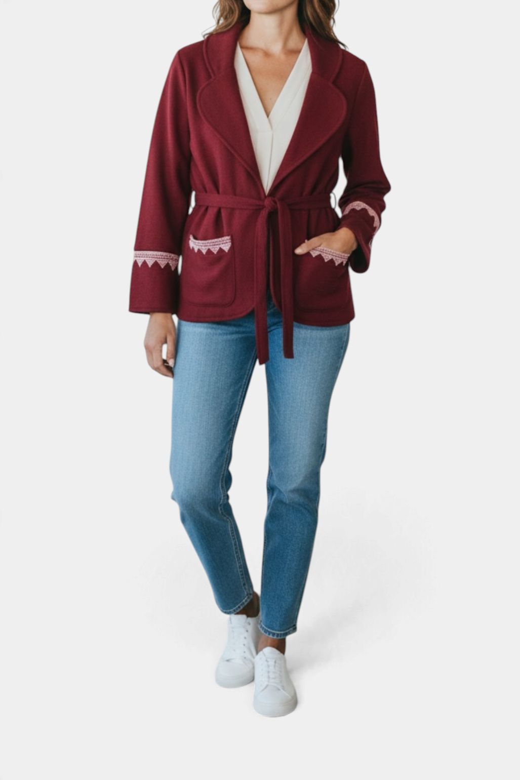 The Copper Shed Leah Jacket in deep burgundy wool with a belted waist and decorative white embroidered trim on pockets
