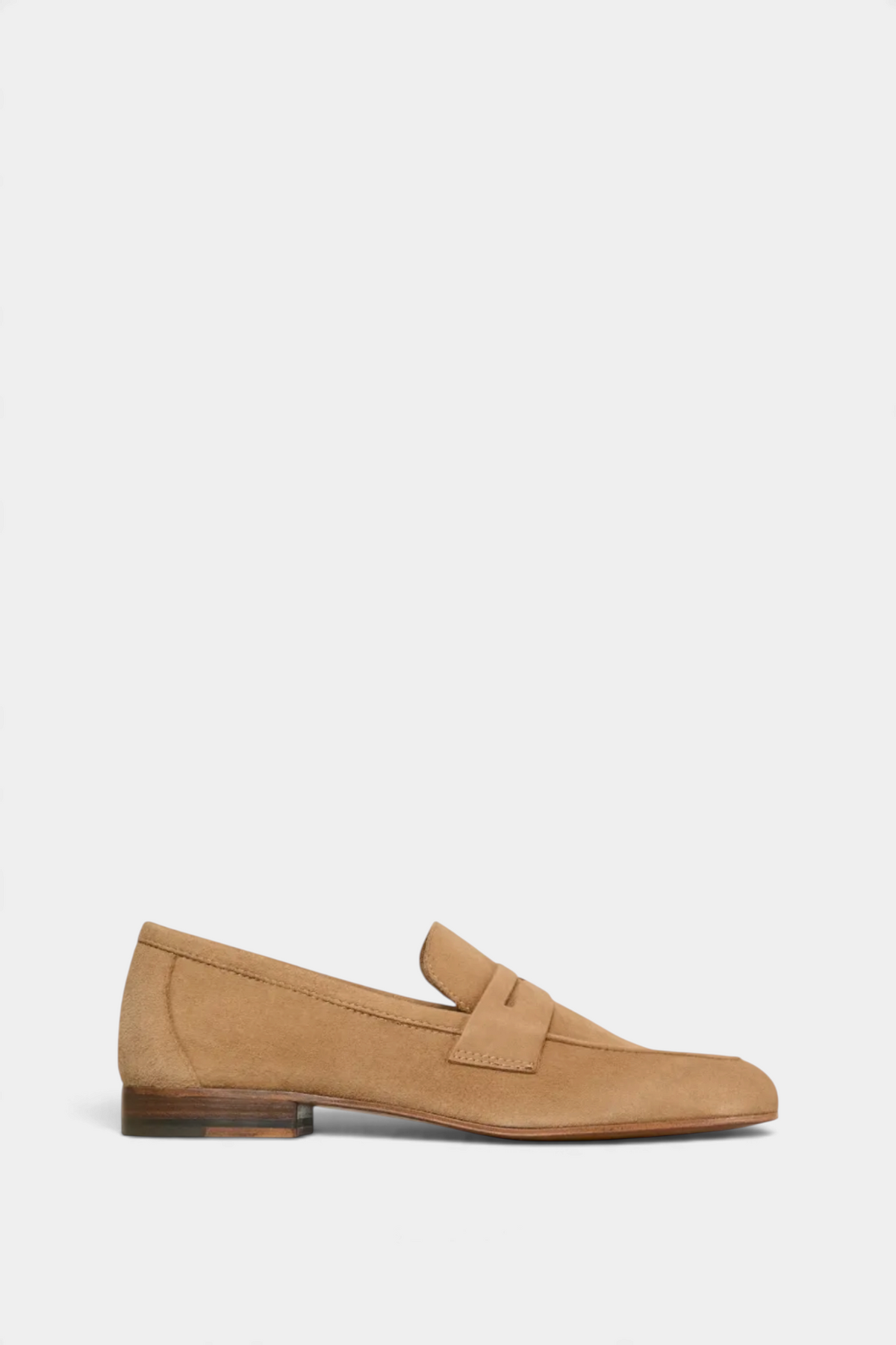 The Copper Shed camel suede unlined penny loafer for summer, featuring a classic slip-on design and low heel.