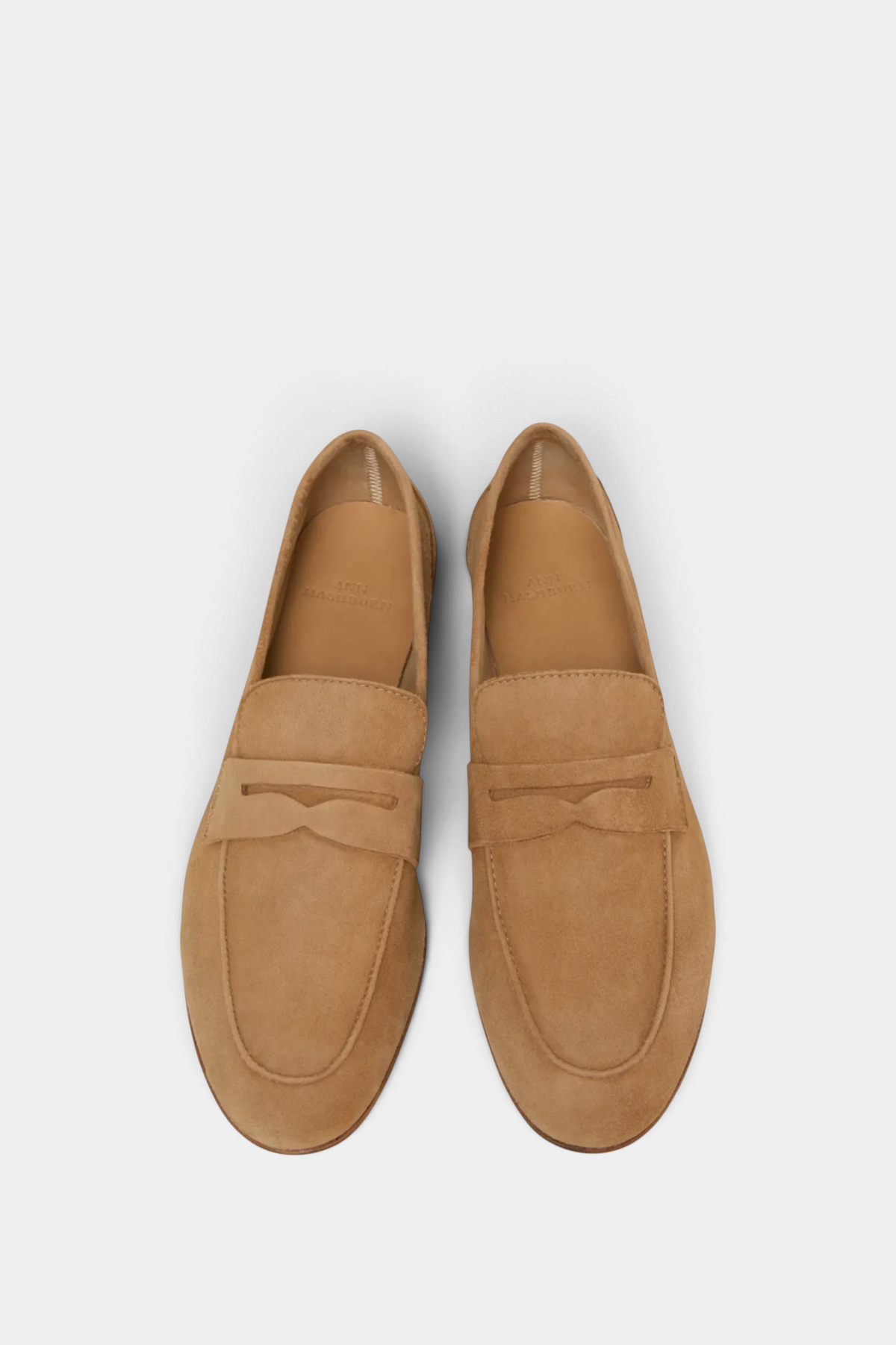 The Copper Shed unlined camel suede penny loafers for summer, featuring a soft minimalist design.