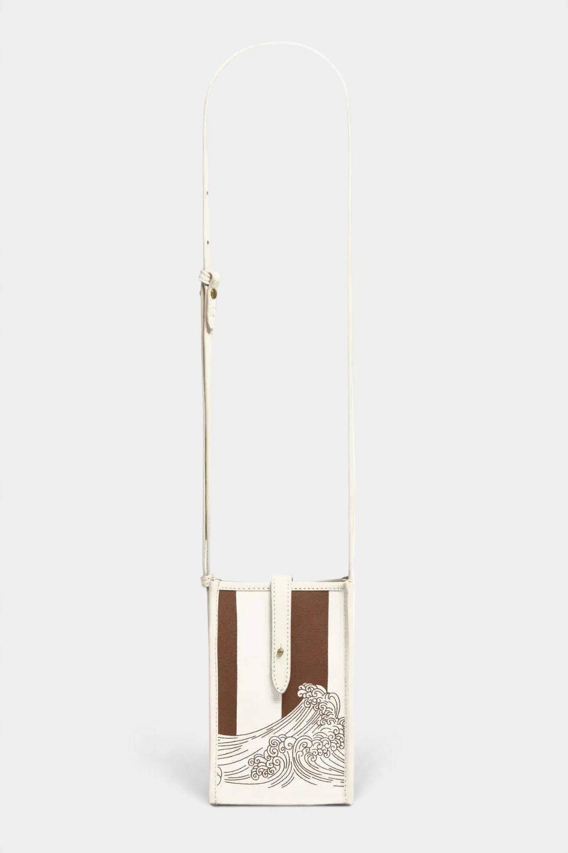 The Copper Shed Caprice Case in Poseidon, a white and brown Italian leather crossbody bag with wave graphic detail.